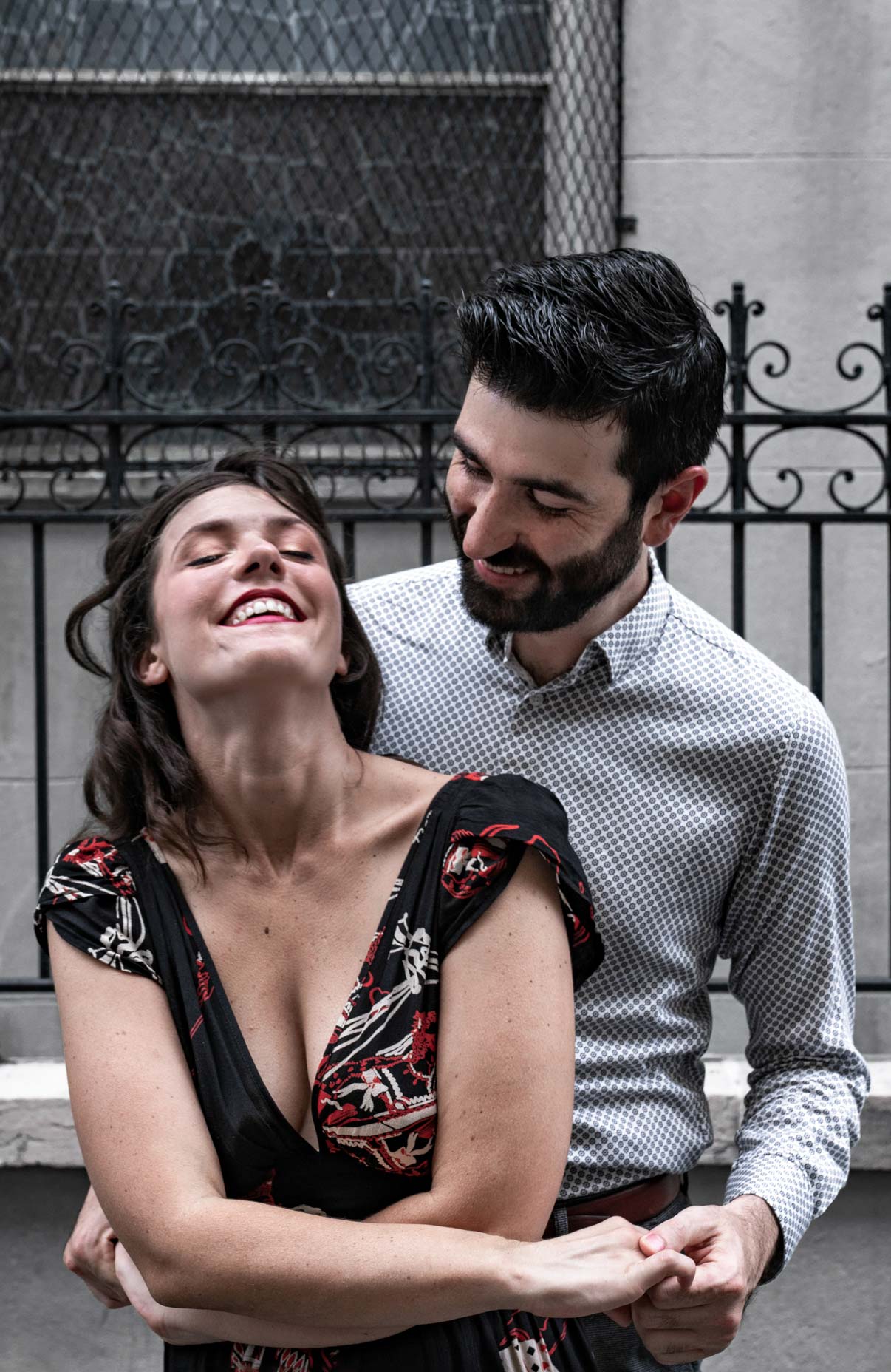 Romantic couple laughing and hugging in the New Orleans French Quarter