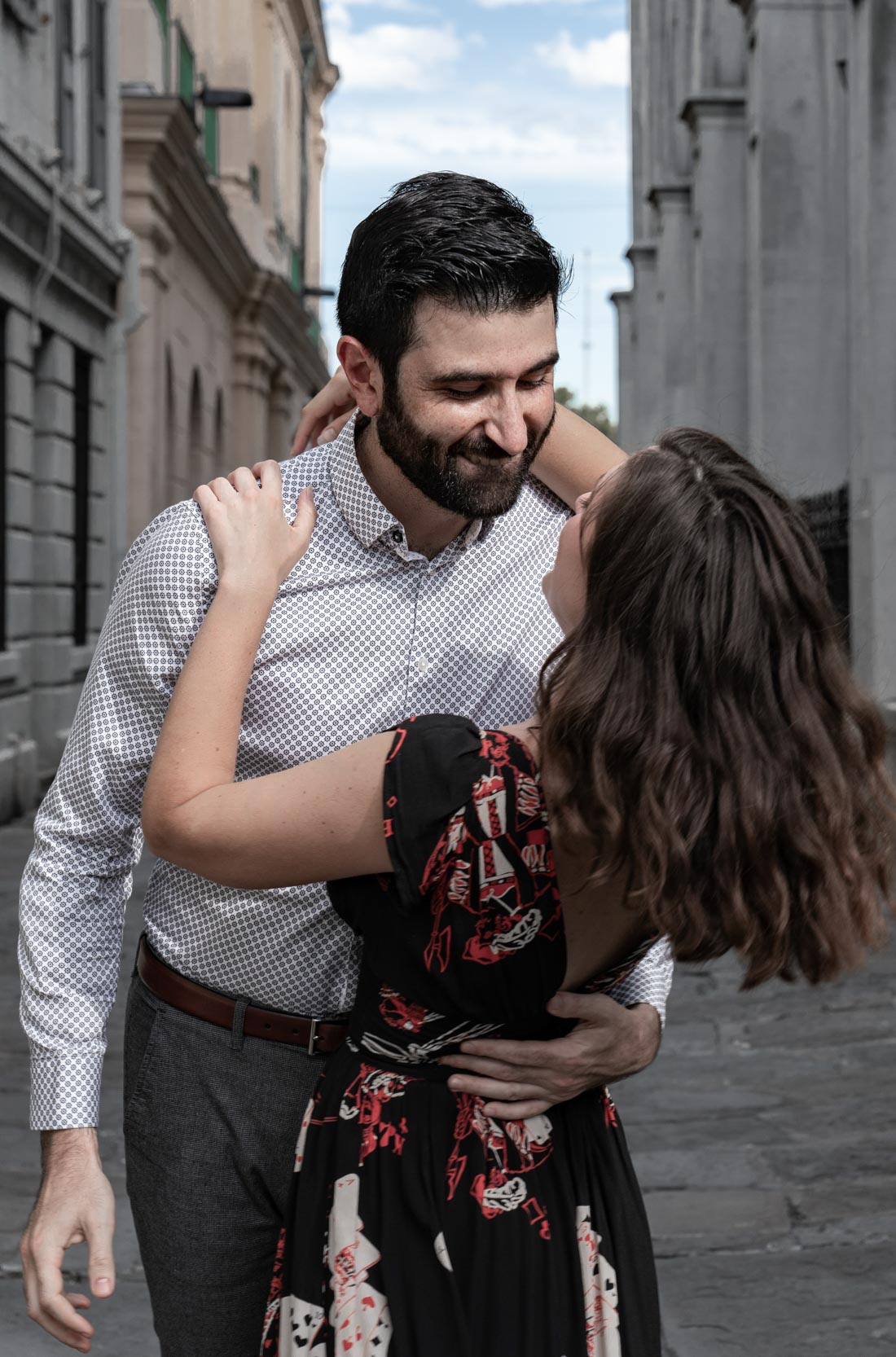 Couple dancing in alleyway near New Orleans French Quarter cathedral