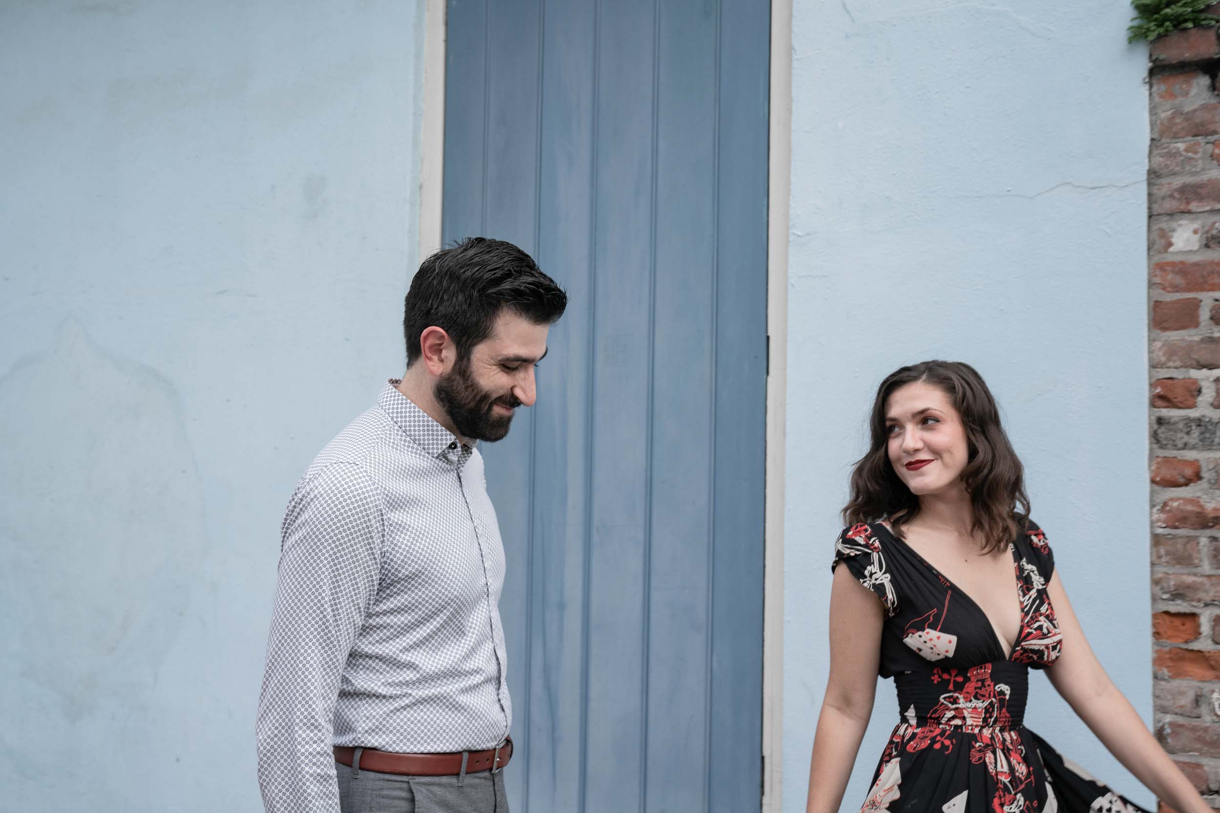 Happy couple walking and smiling together in the New Orleans French Quarter