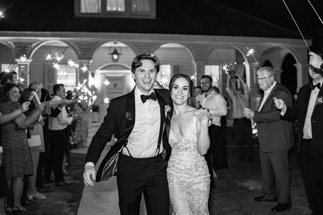 Sparkler exit with bride and groom smiling at Maison Lafitte in Covington, Louisiana