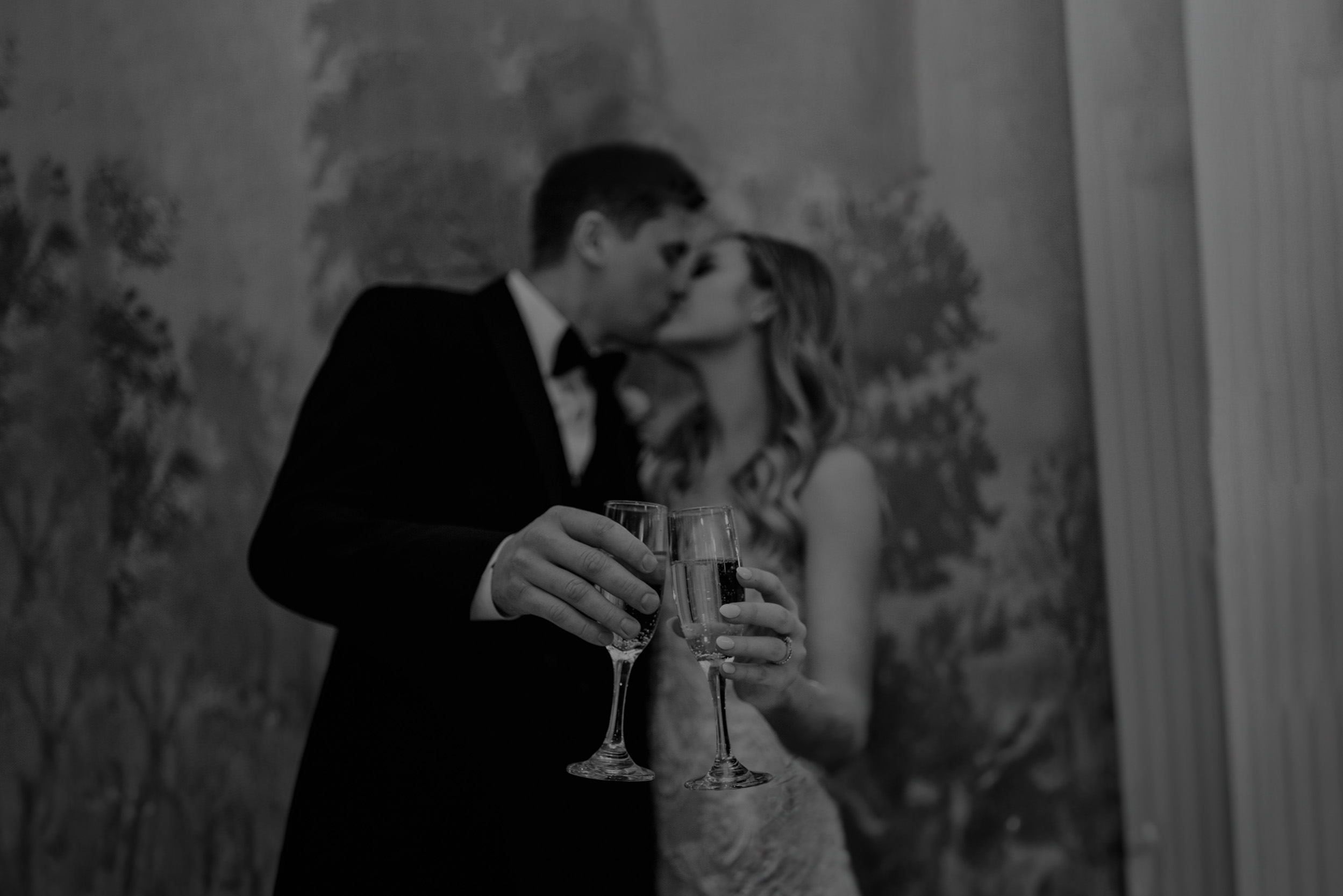 bride and groom cutting cake and having a toast with champagne at the Riverview Room in New Orleans