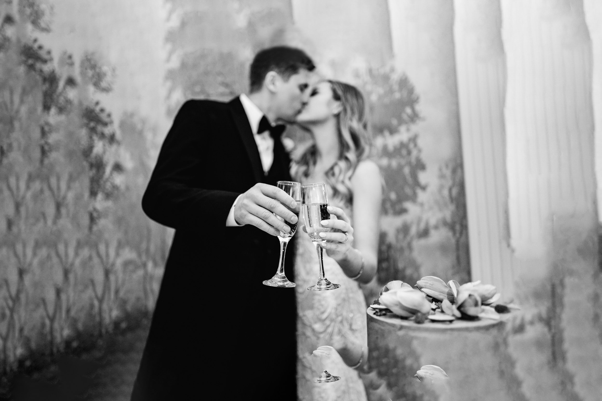 bride and groom cutting cake and having a toast with champagne at the Riverview Room in New Orleans