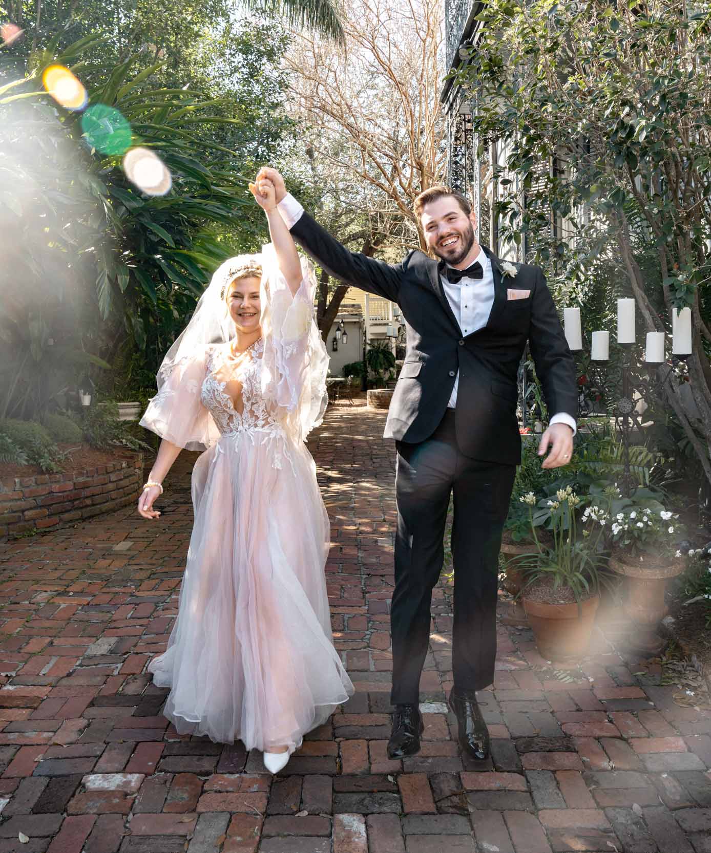 bride and groom celebrating after elopement in the French Quarter of New Orleans