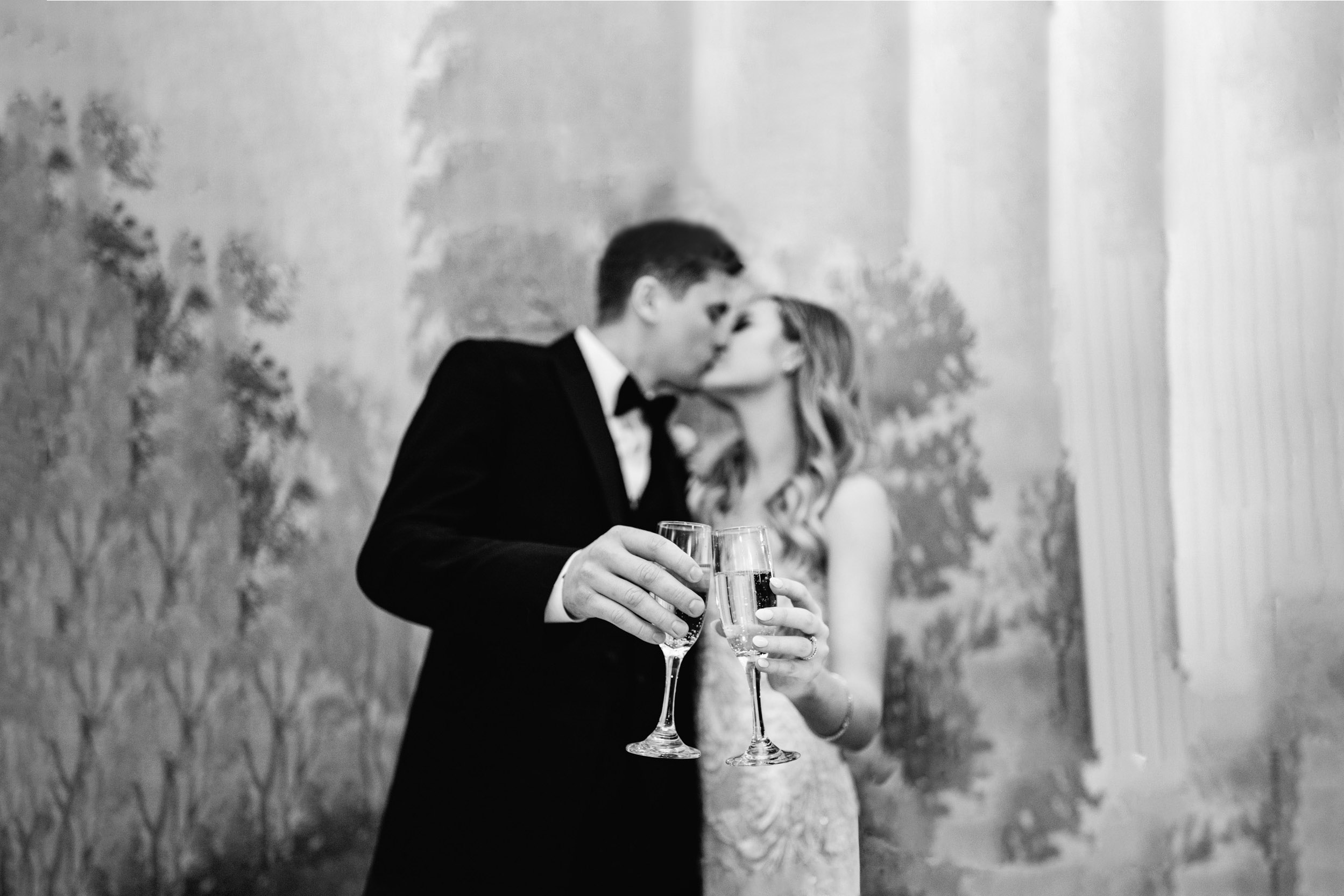 bride and groom cutting cake and having a toast with champagne at the Riverview Room in New Orleans