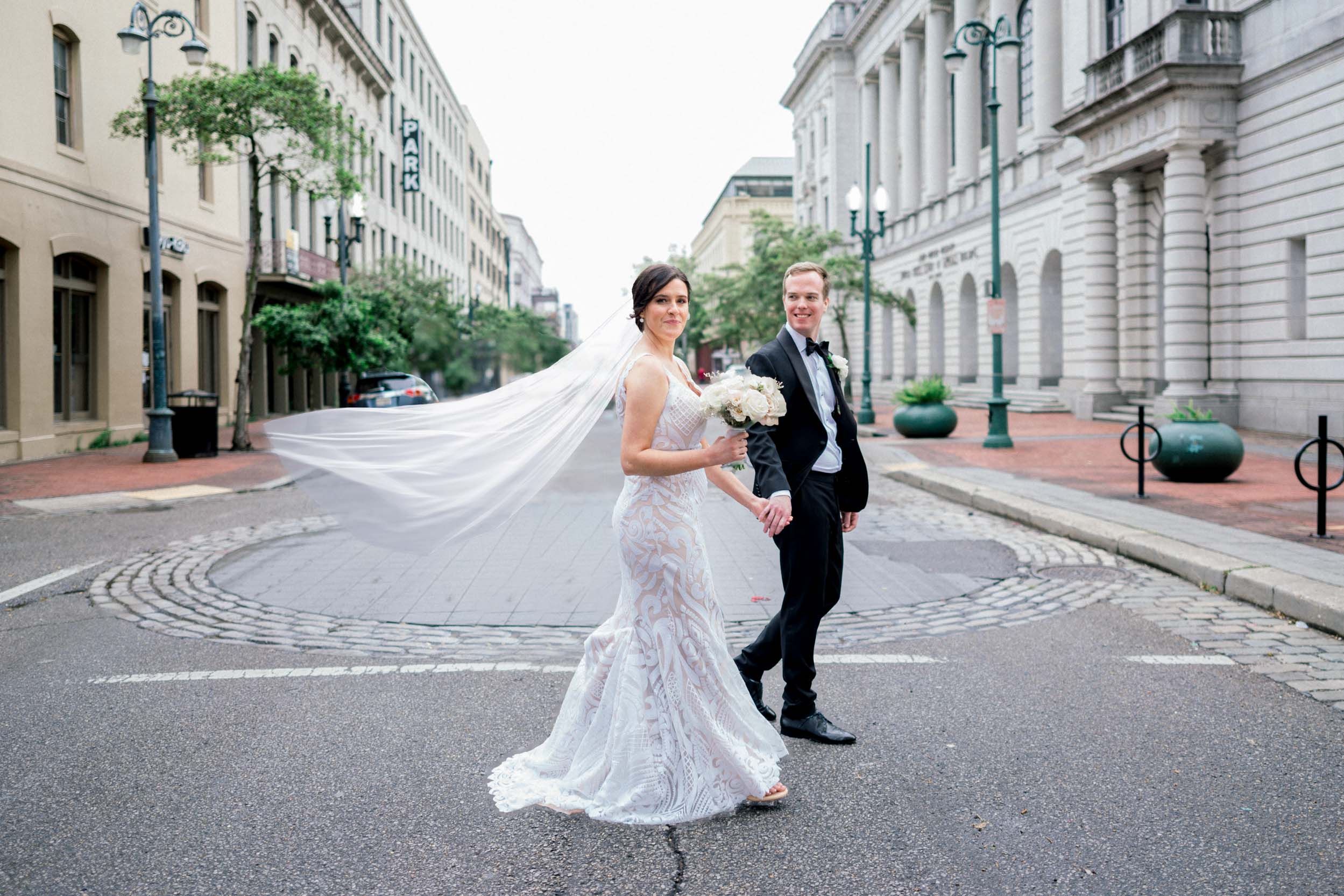 Bride and groom strolling in French Quarter of New Orleans