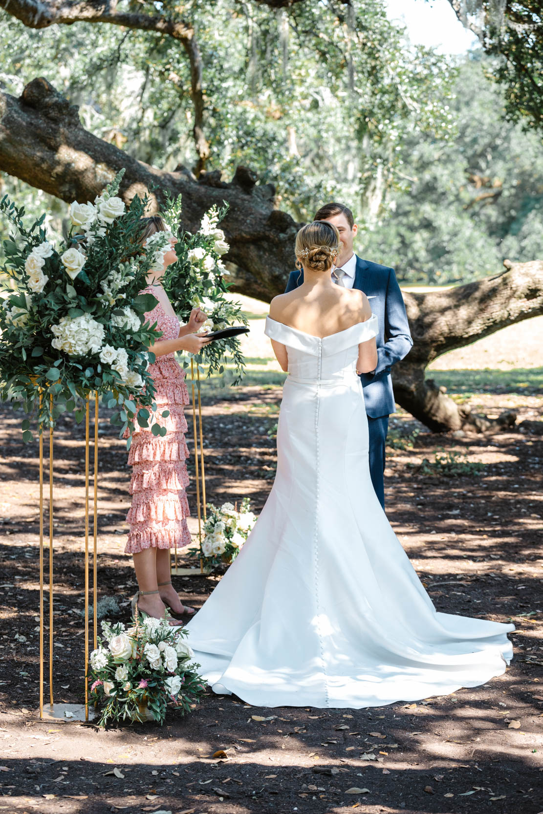 back of wedding gown during ceremony at the Tree of Life in New Orleans