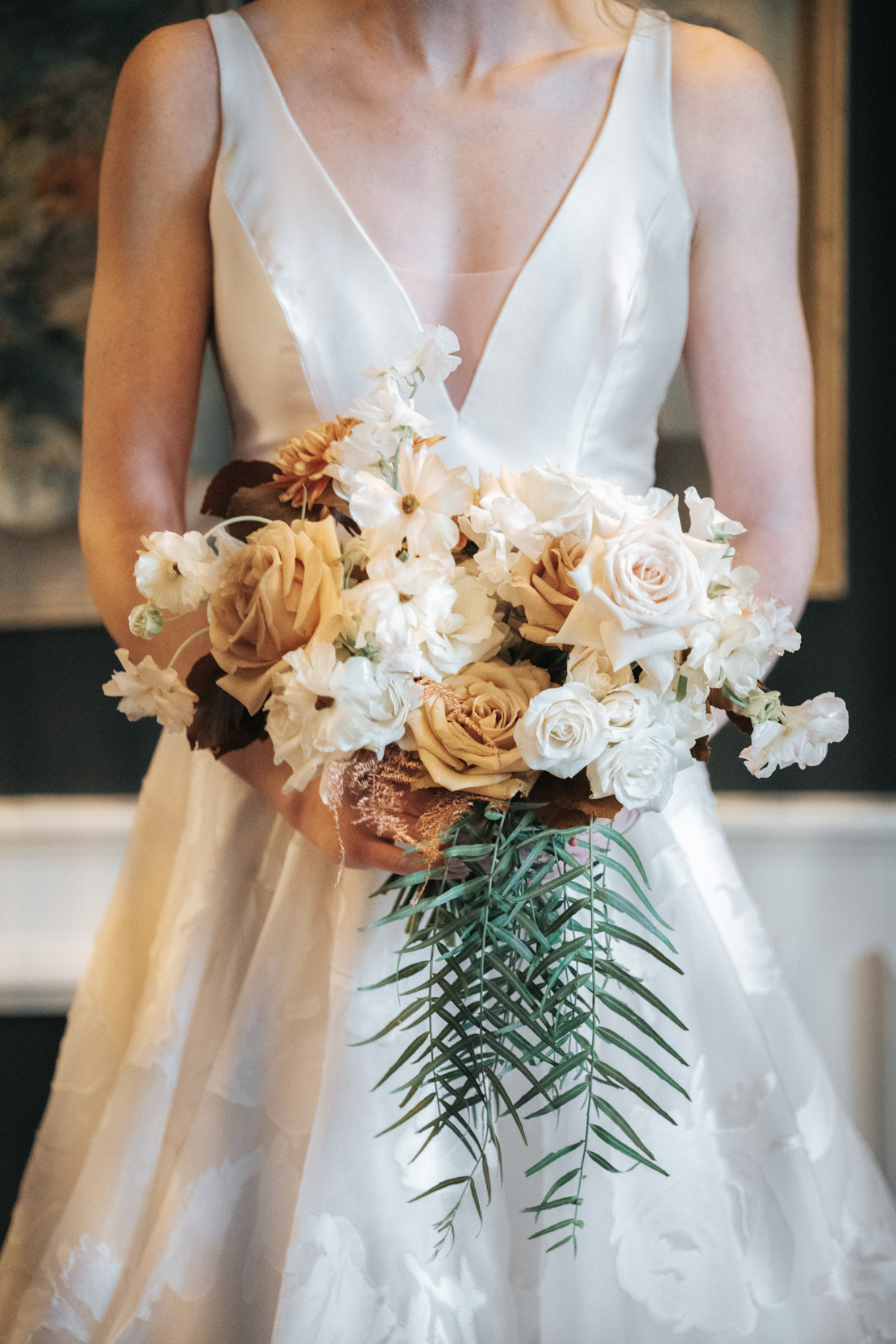 bride posing with flowers at The Pontchartrain Hotel in New Orleans