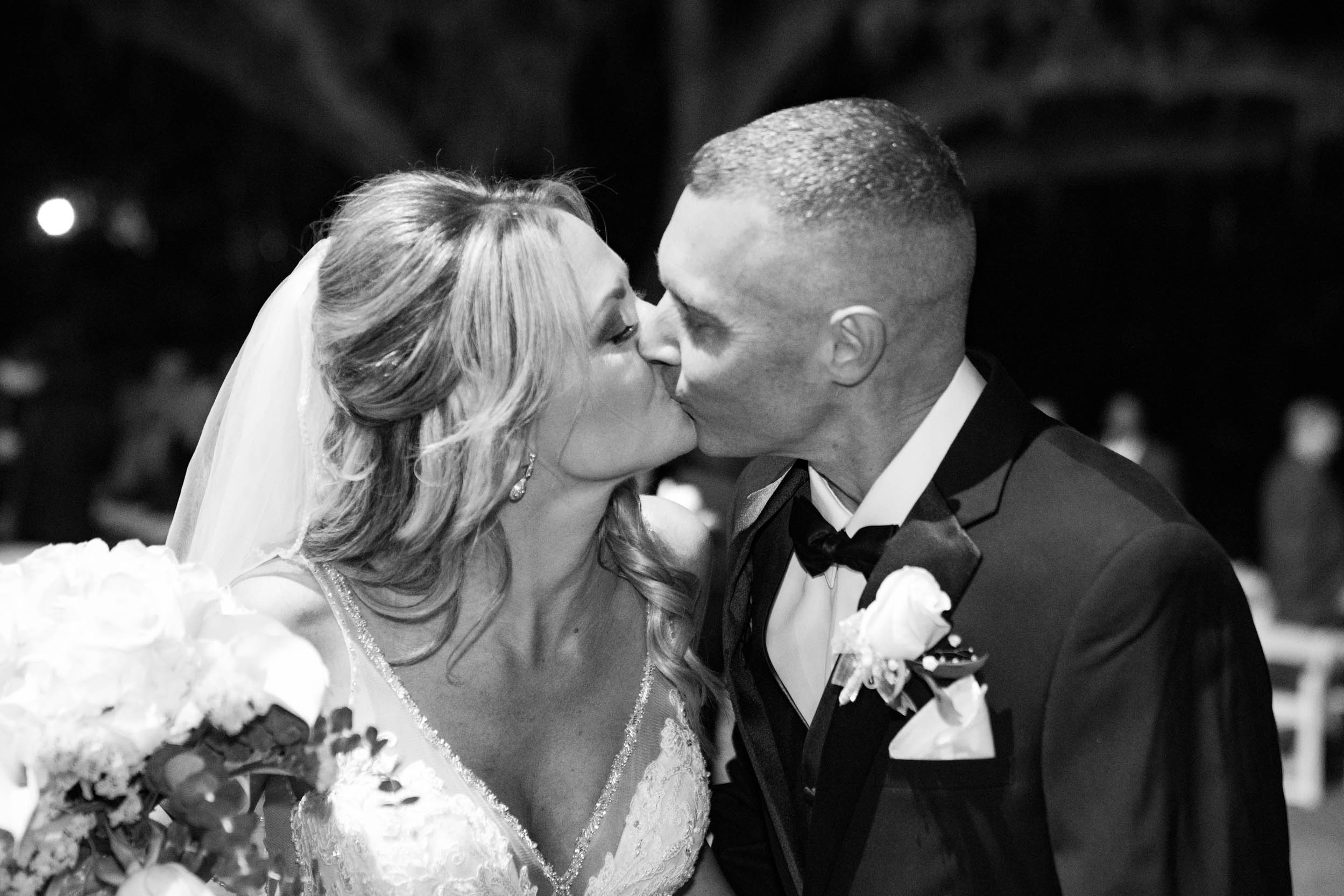 bride and groom kissing after wedding ceremony at Destrehan Plantation in Louisiana