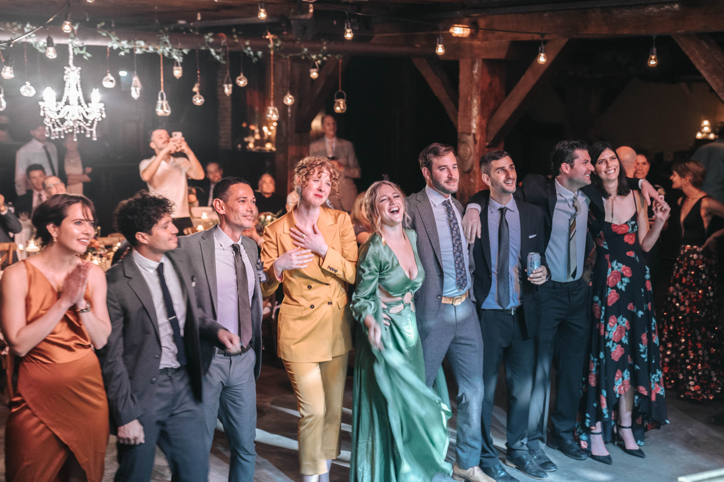 wedding guests smiling and laughing at The Republic venue in New Orleans