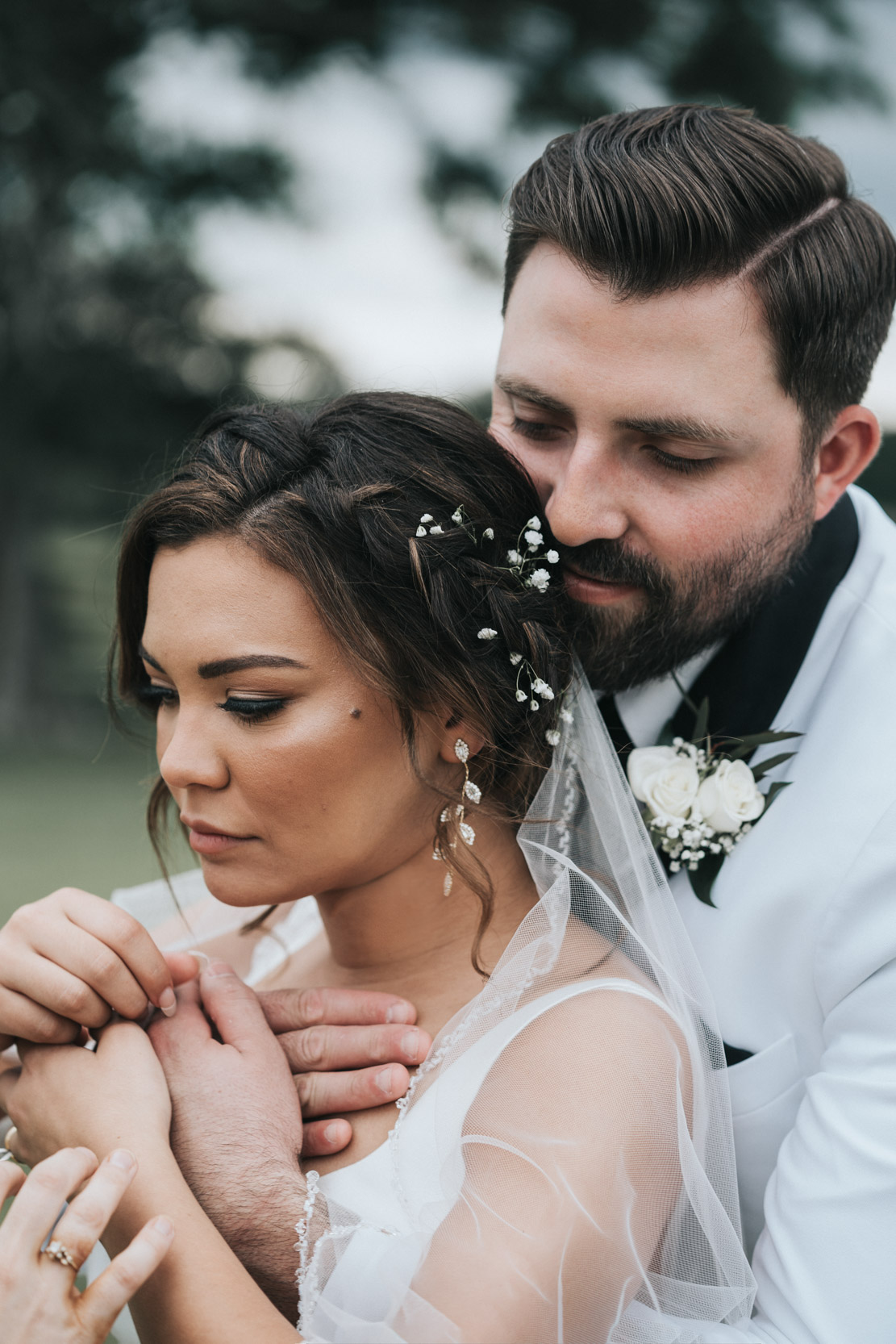 groom hugging bride on wedding day at White Magnolia in Kentwood, Louisiana