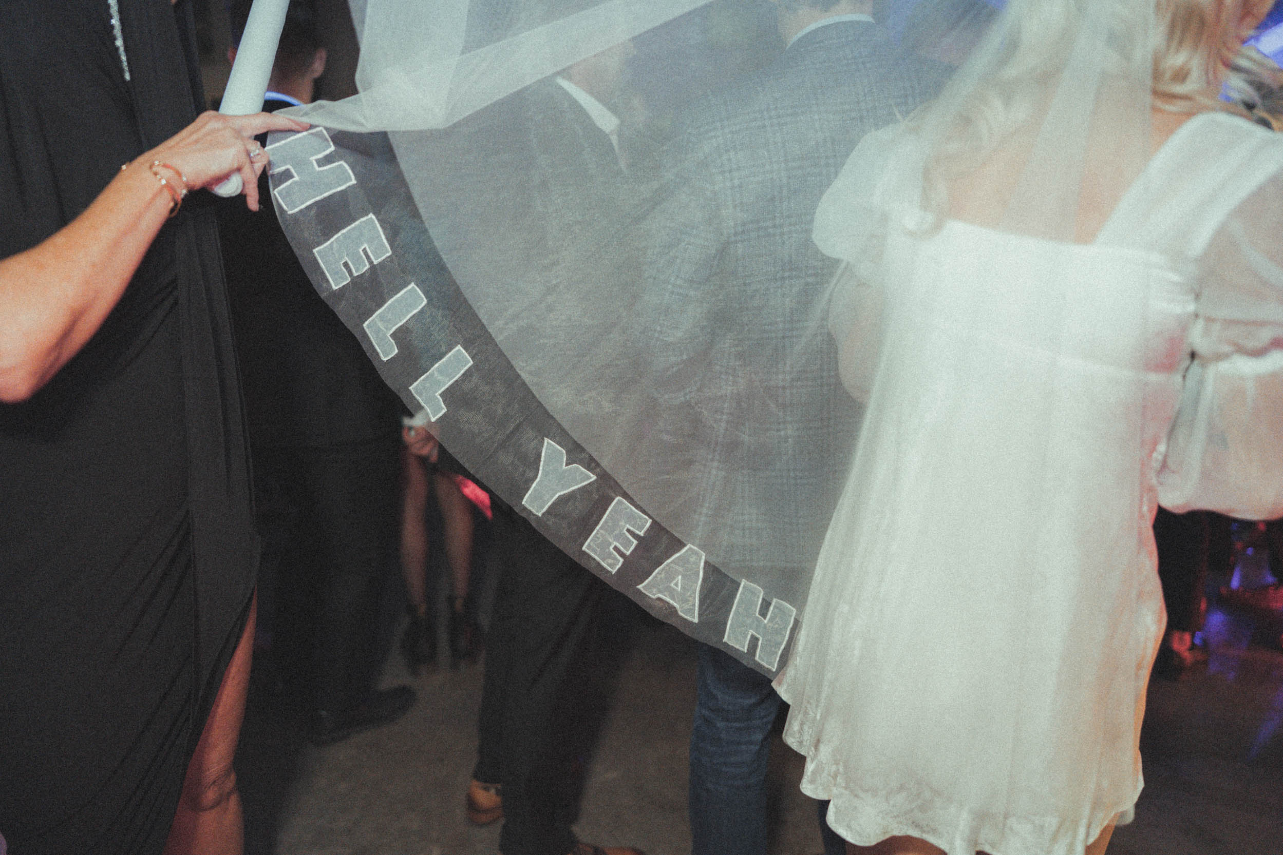 cool bridal veil with "Hell Yah" written on it