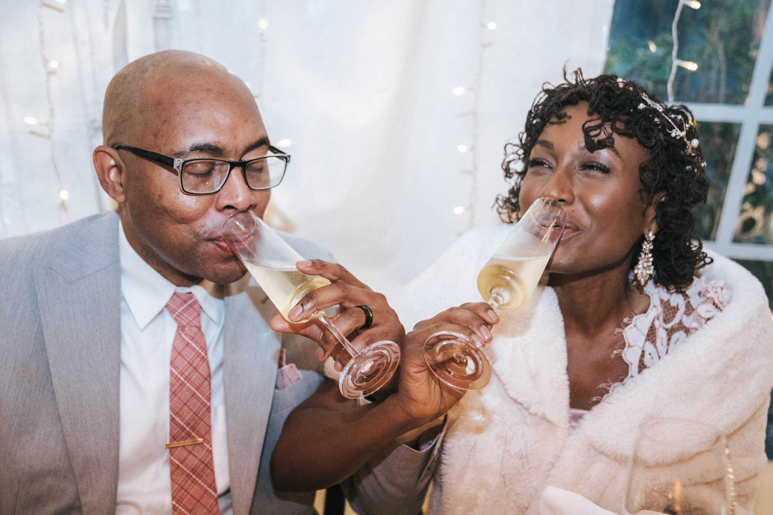 bride and groom having a toast of champagne during wedding reception at Saba Restaurant