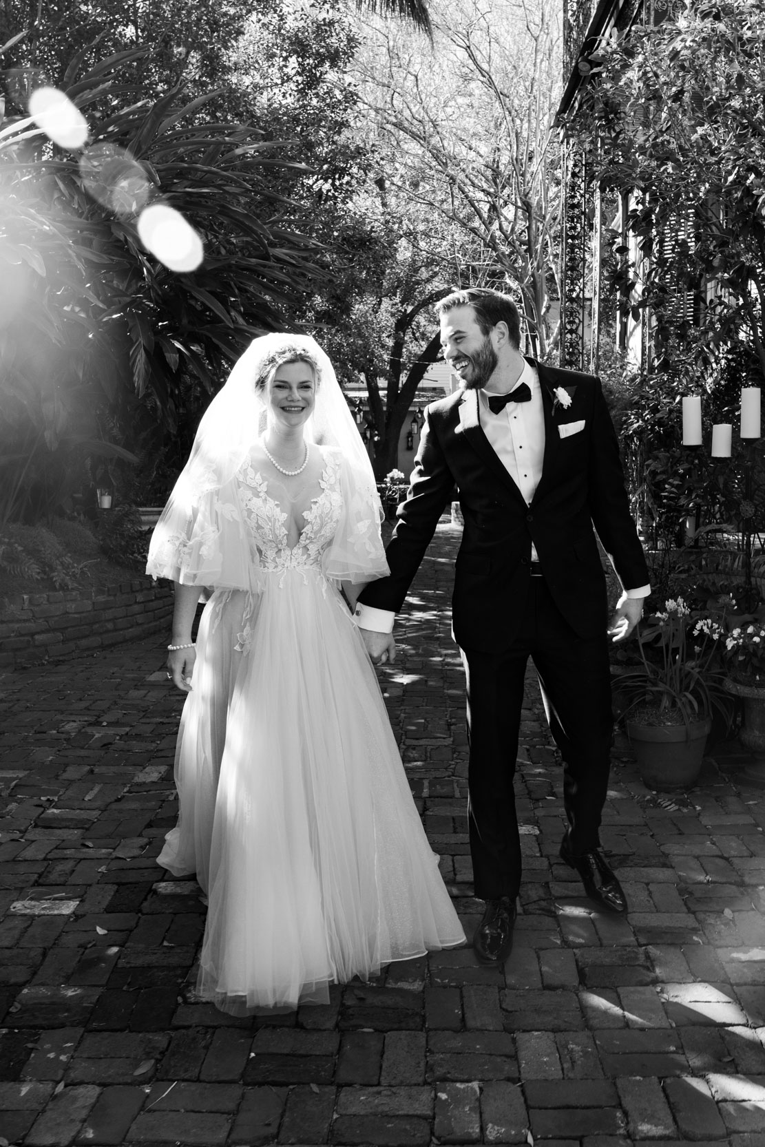 bride and groom laughing after elopement in the French Quarter of New Orleans