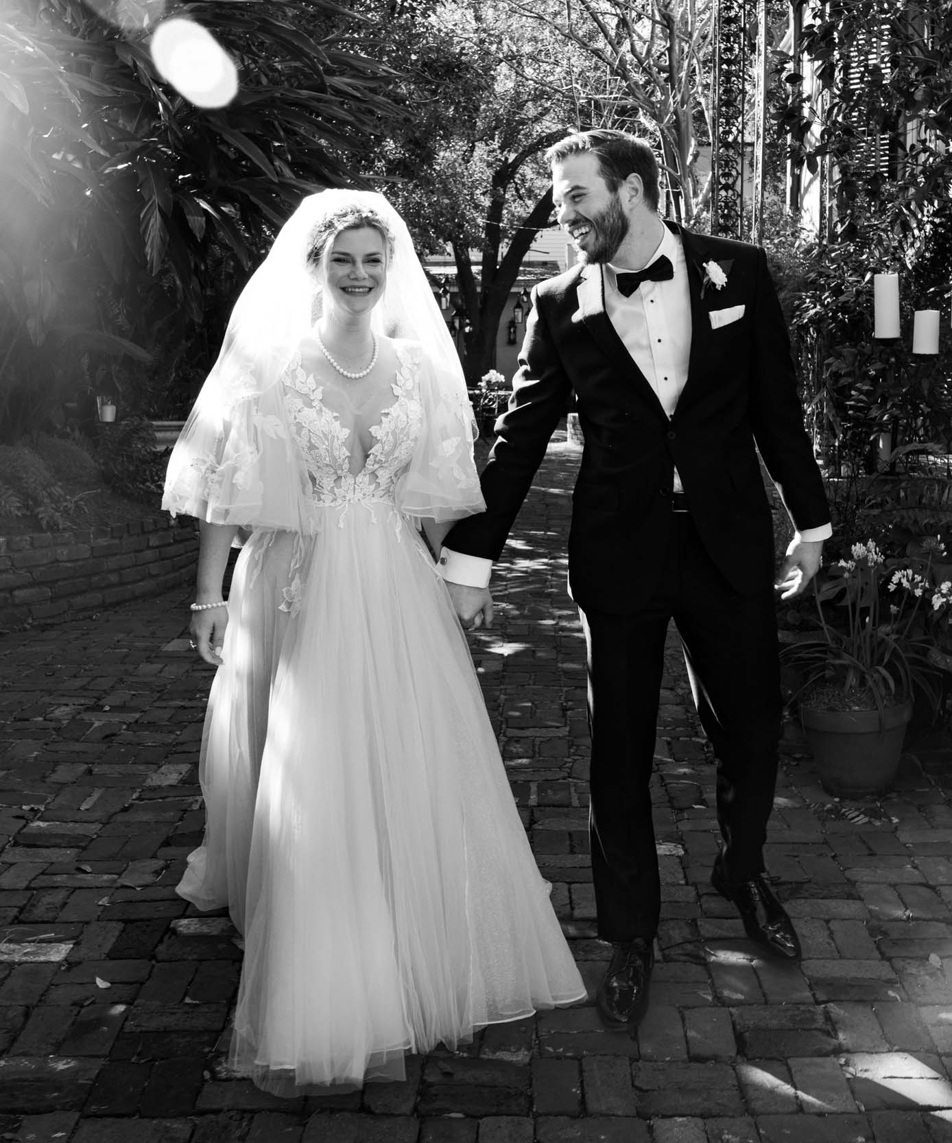 bride and groom laughing after elopement in the French Quarter of New Orleans