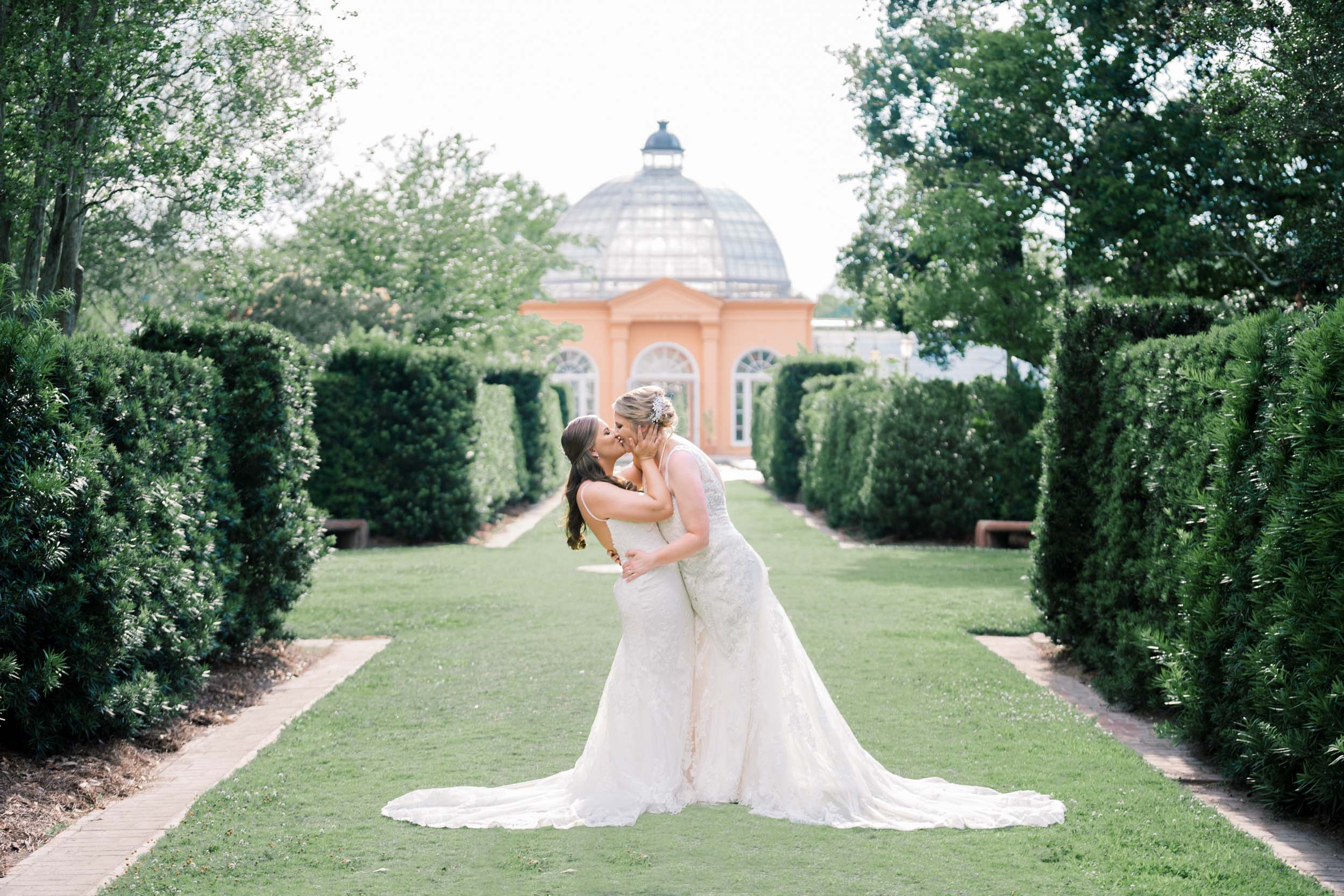 gay couple kissing during wedding at Botanical Gardens in City Park New Orleans