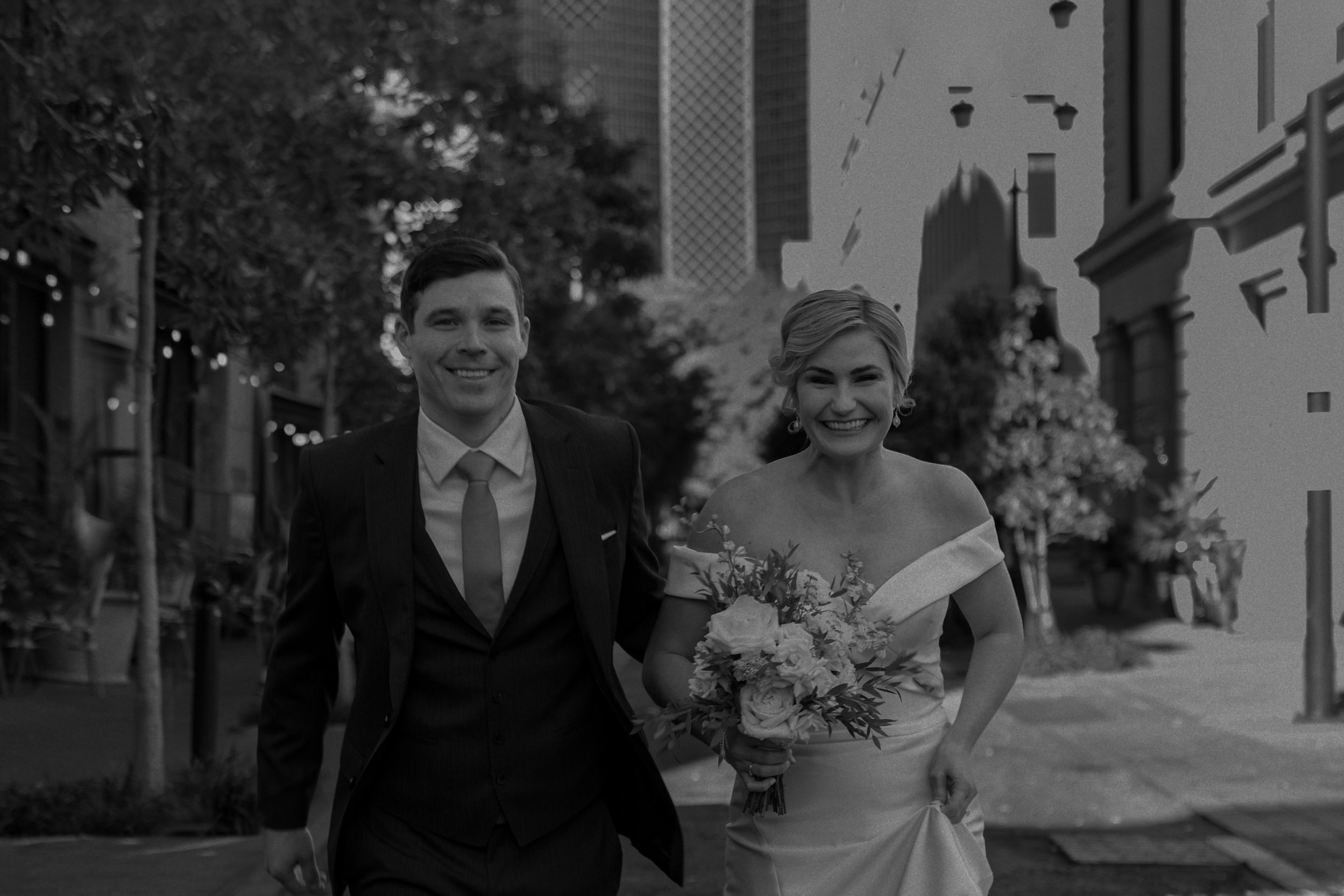 Bride and groom strolling in French Quarter New Orleans