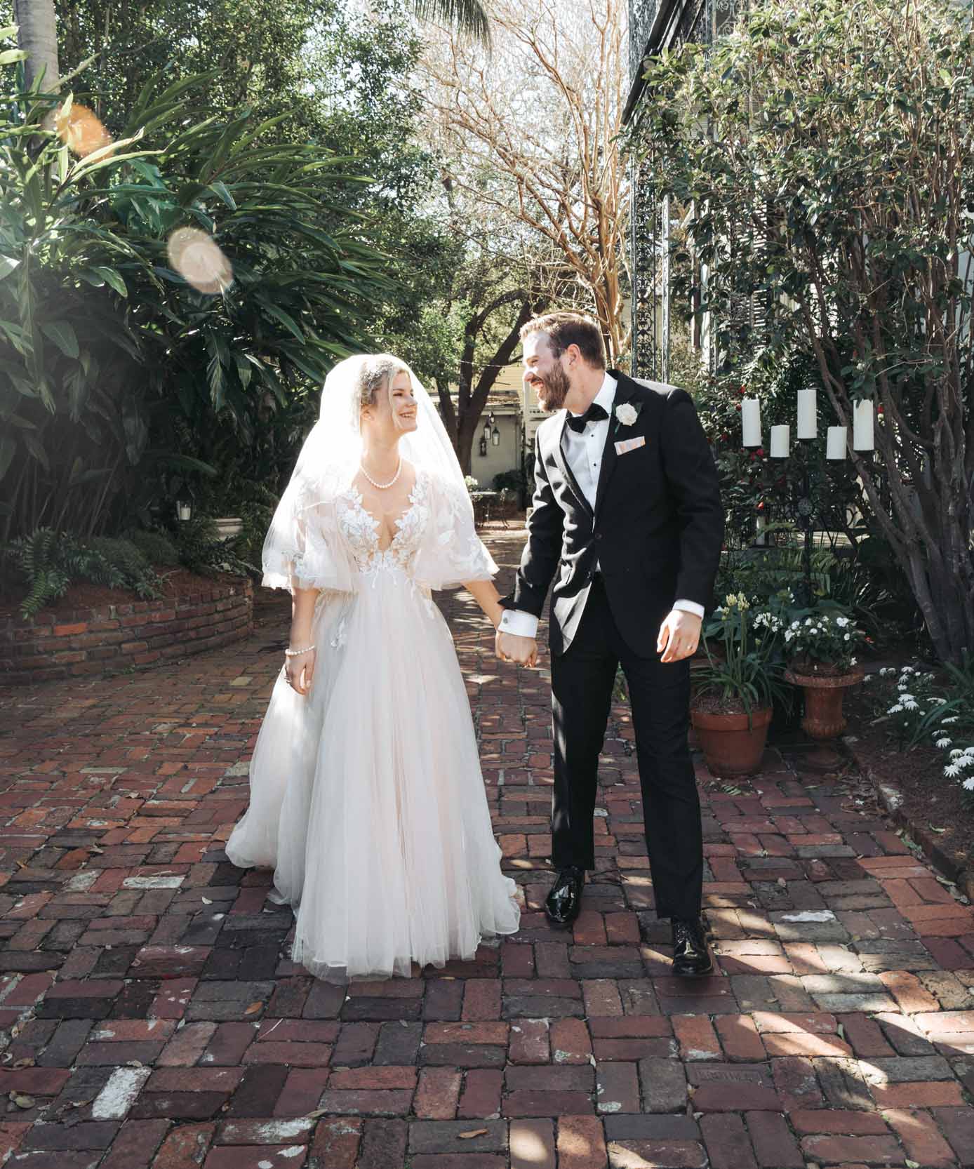 bride and groom laughing after elopement in the French Quarter of New Orleans