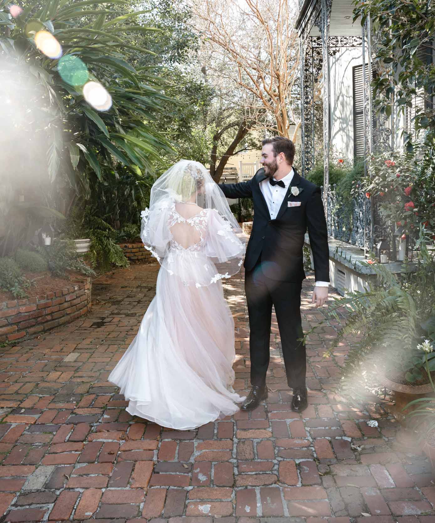 bride and groom dancing after elopement in the French Quarter of New Orleans