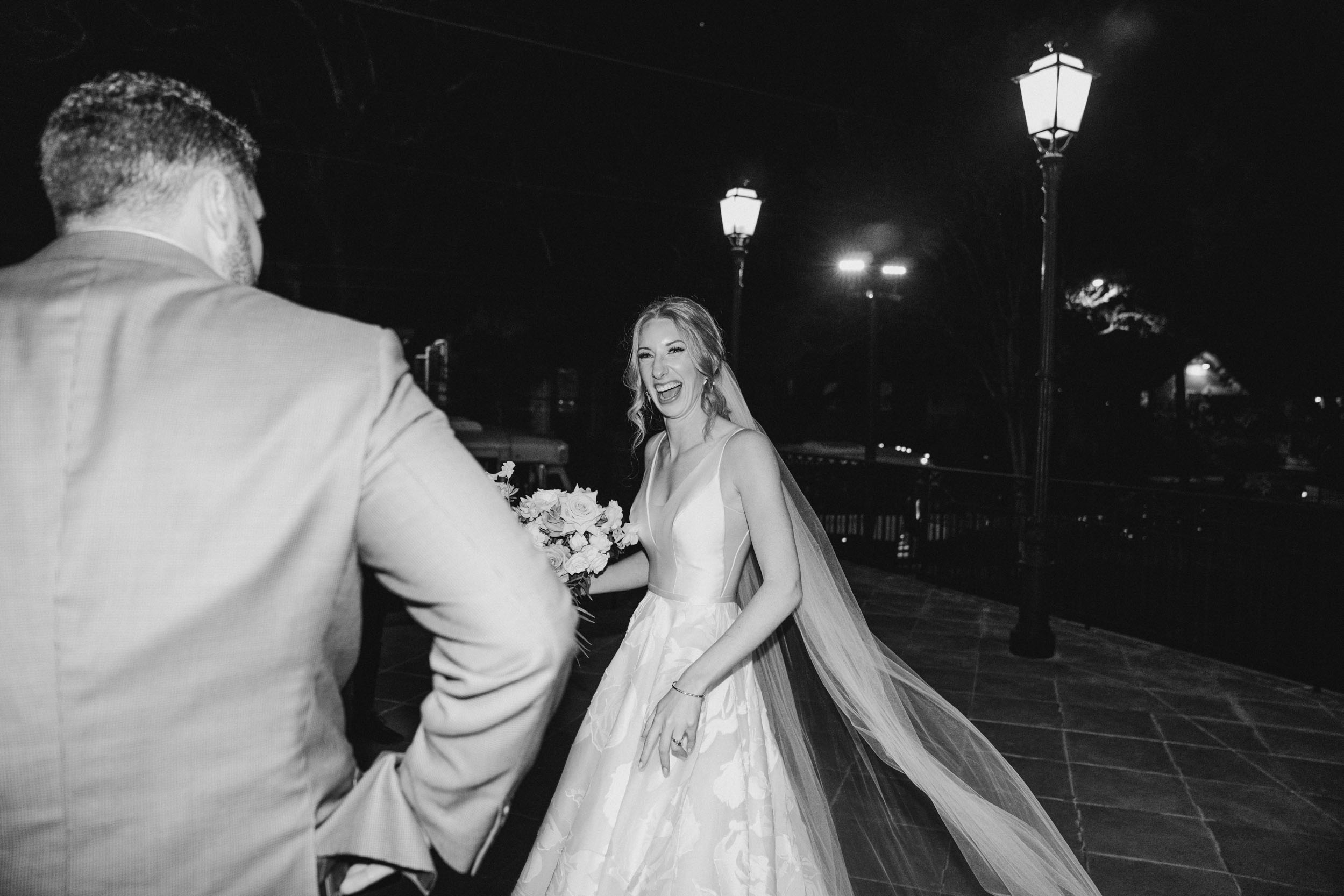 bride laughing and celebrating with groom after ceremony at Ursuline Church in New Orleans