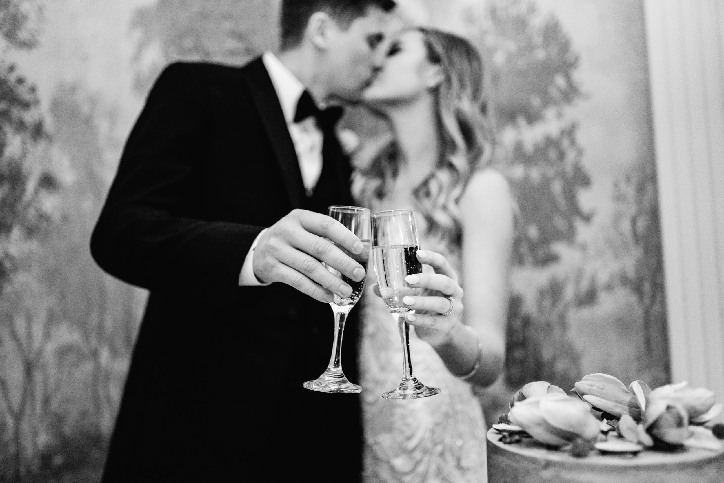 bride and groom cutting cake and having a toast with champagne at the Riverview Room in New Orleans