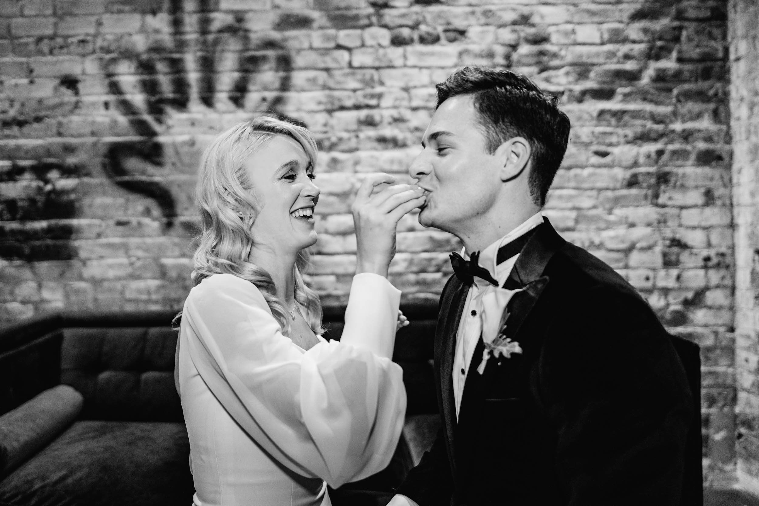 Bride and Groom sharing cake at Capulet in New Orleans