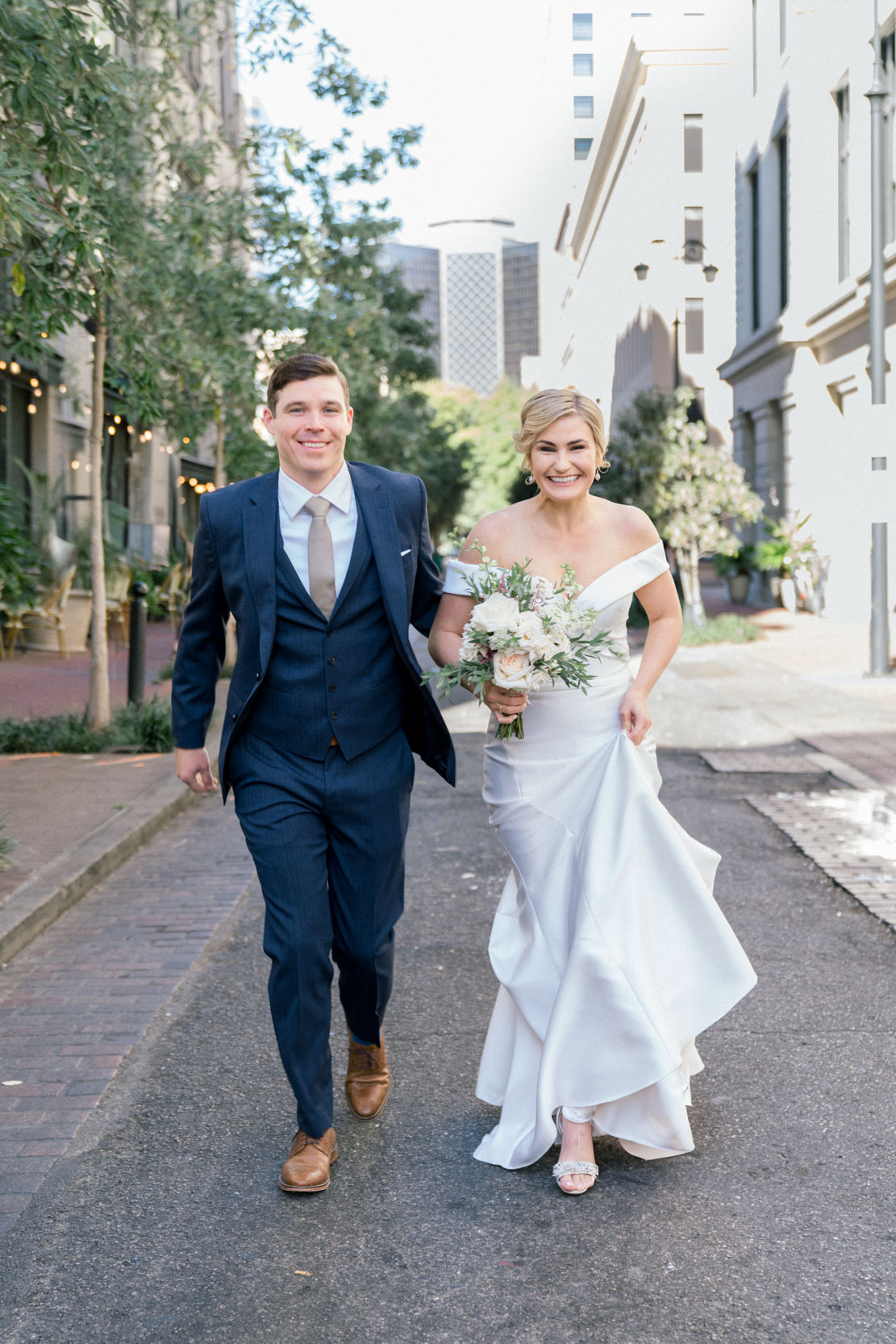 Bride and groom strolling in French Quarter New Orleans