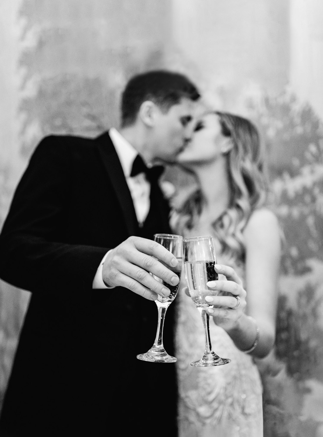 bride and groom cutting cake and having a toast with champagne at the Riverview Room in New Orleans