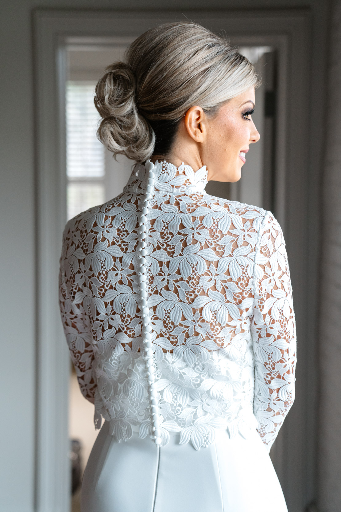 Back of Chantilly lace wedding dress and bride's hair at the Southern Hotel in Covington, Louisiana