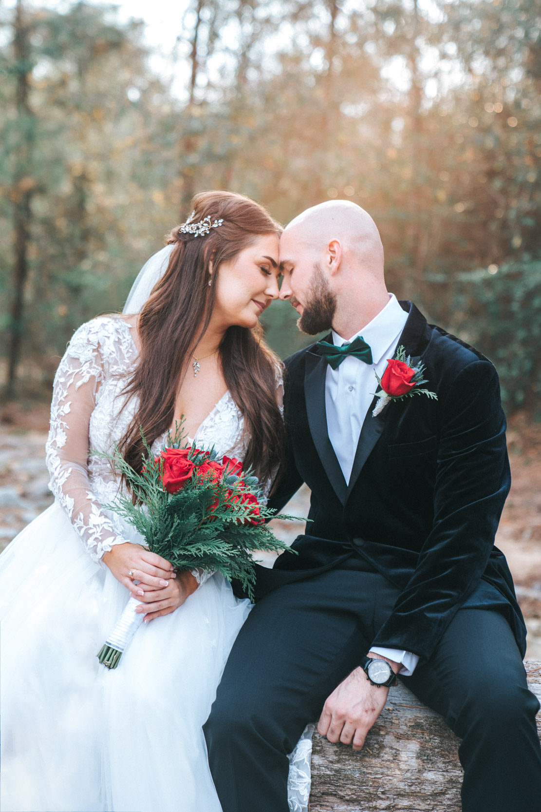 Bride and groom in touching heads together before wedding during first look at Creekview Barn in Mississippi