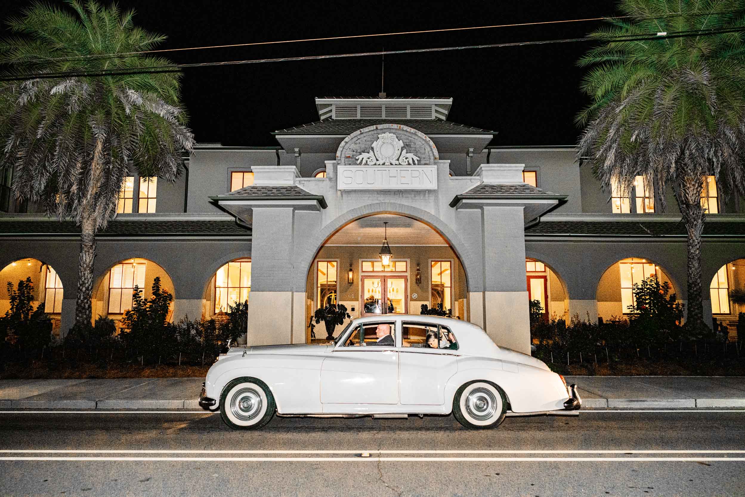 Rolls-Royce by Classic Motorcars (Daniel Moran) parked at night in front of the Southern Hotel in Covington, Louisiana on wedding day