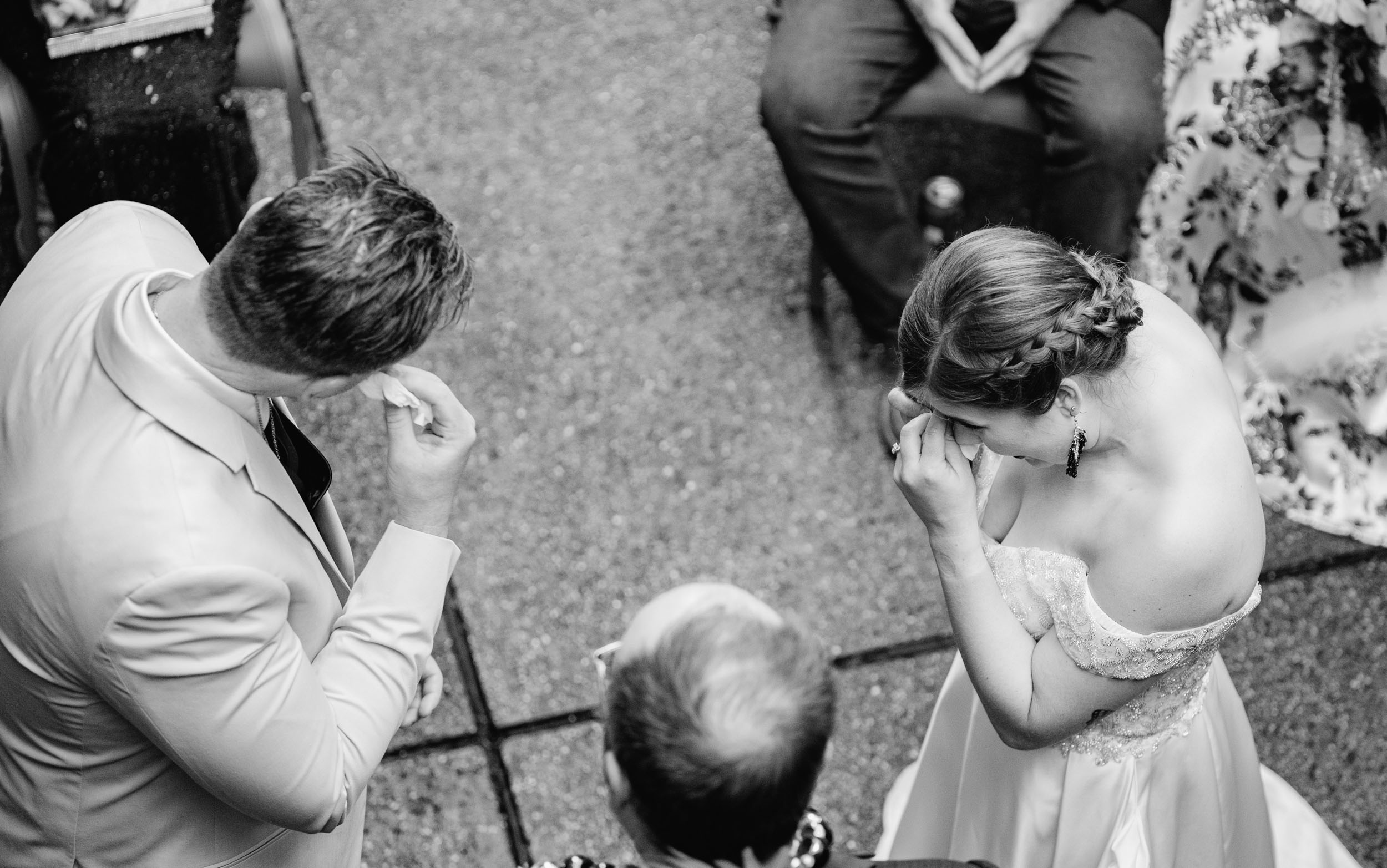 bride and groom crying during wedding ceremony in New Orleans at the Historic Swoop Duggins House