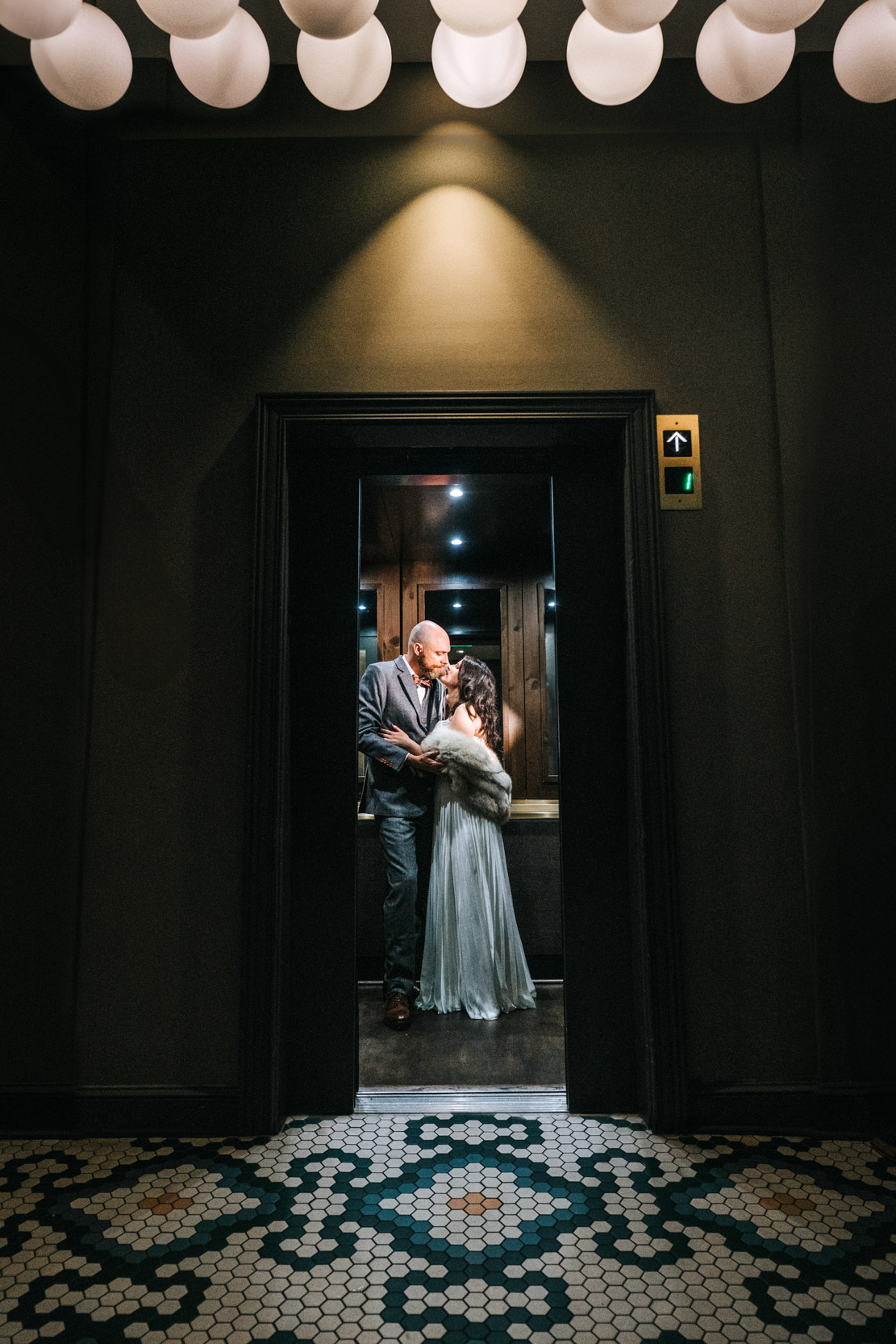 bride and groom kissing inside elevator at The Eliza Jane Hotel in New Orleans