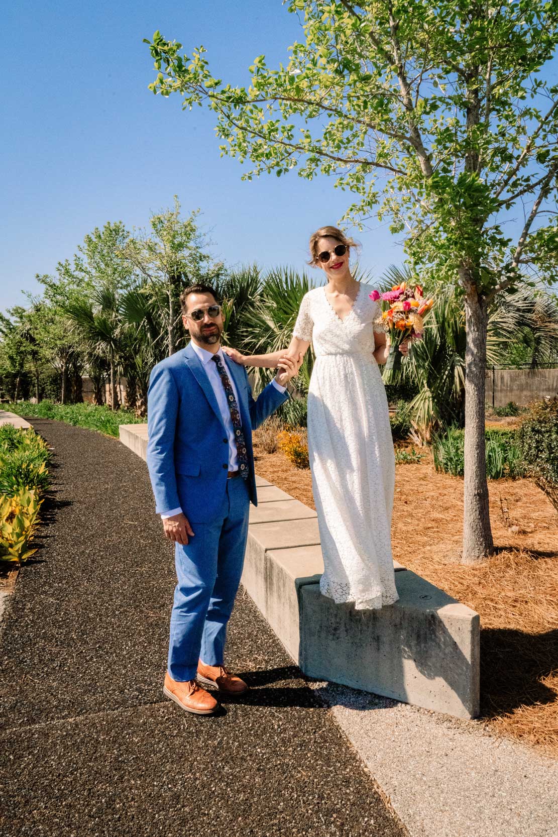 bride and groom wearing sunglasses on sunny wedding day at Crescent Park in the New Orleans Bywater