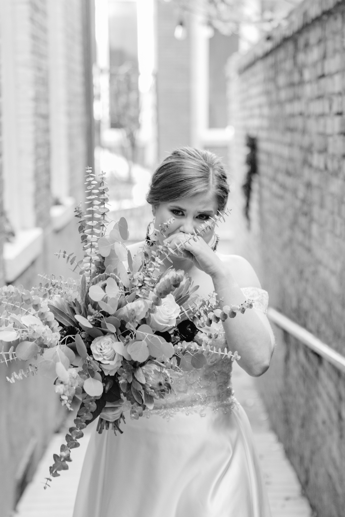 bride crying during wedding ceremony after seeing groom at the Historic Swoop Duggins House in New Orleans