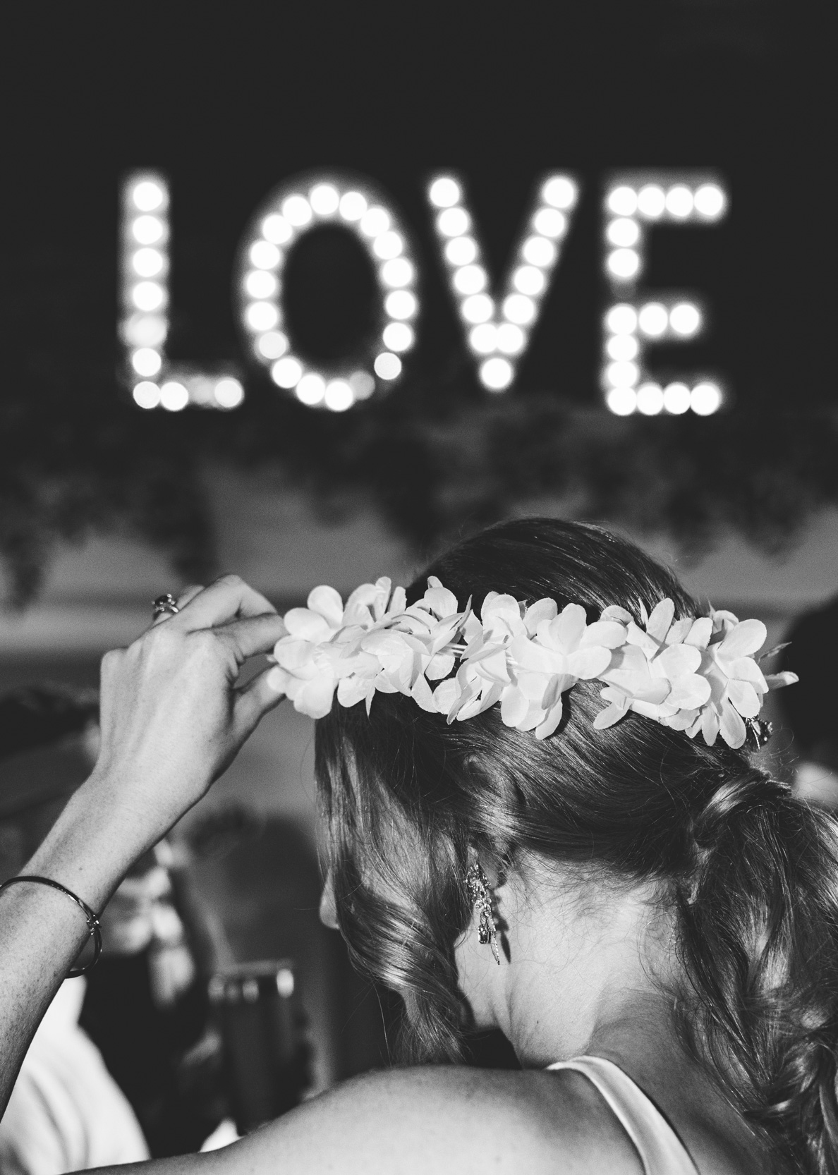 bride wearing flower crown hair piece during wedding reception at the Capulet venue in Bywater New Orleans