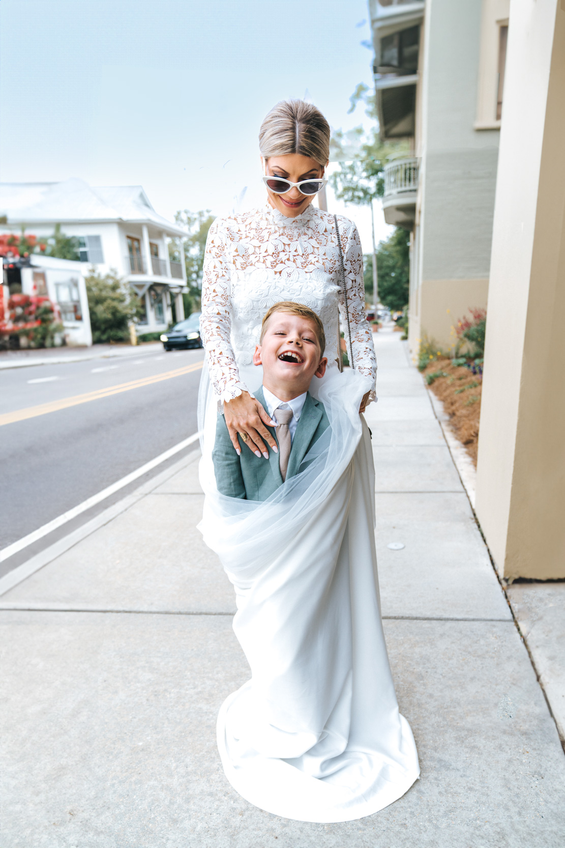 bride wrapping up her son in her wedding dress at the Southern Hotel in Covington, Louisiana