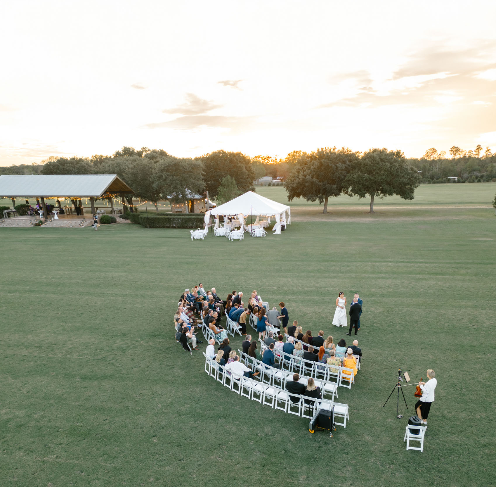 drone photograph of a wedding ceremony at sunset at The New Orleans Polo Club in Covington, Louisiana