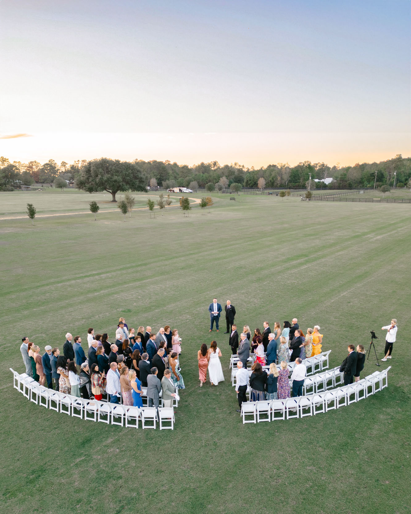 drone photograph of wedding ceremony in field at The New Orleans Polo Club in Covington, Louisiana