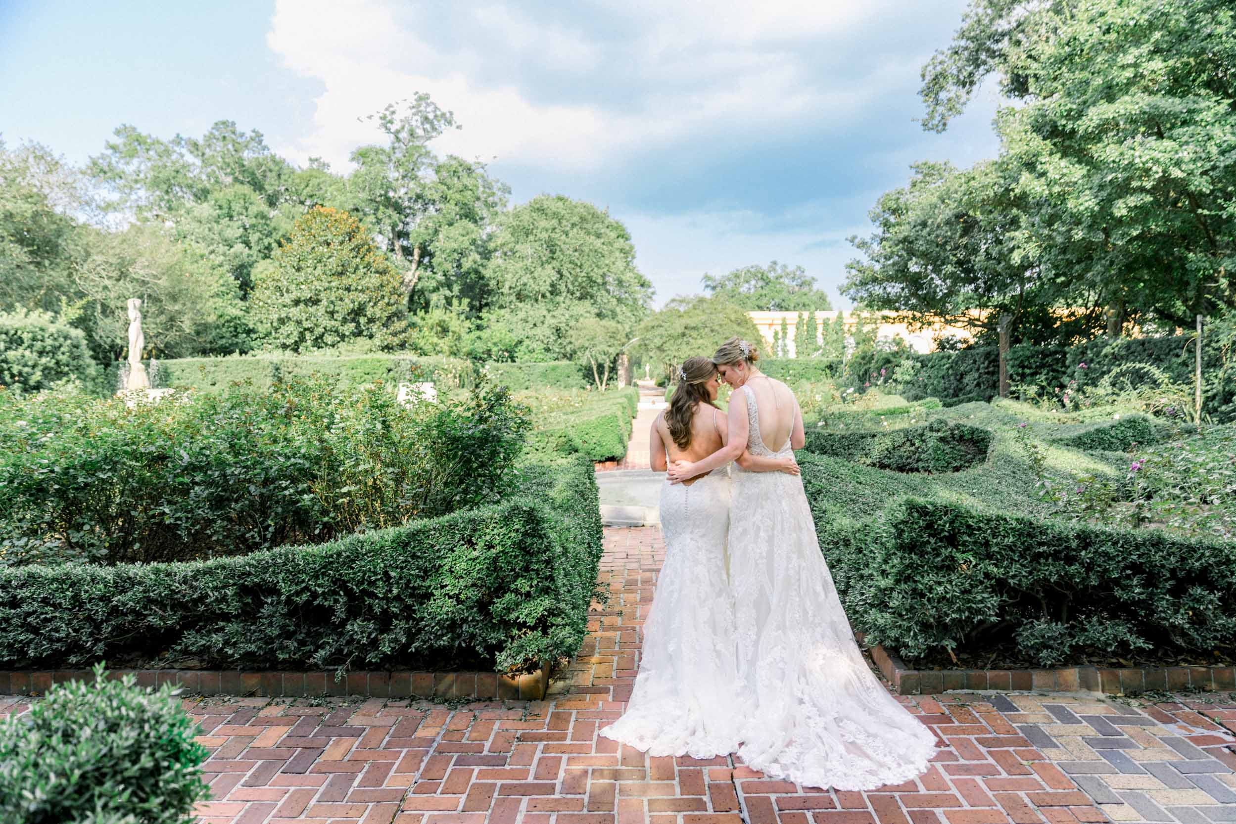 gay wedding couple hugging in City Park Botanical Gardens