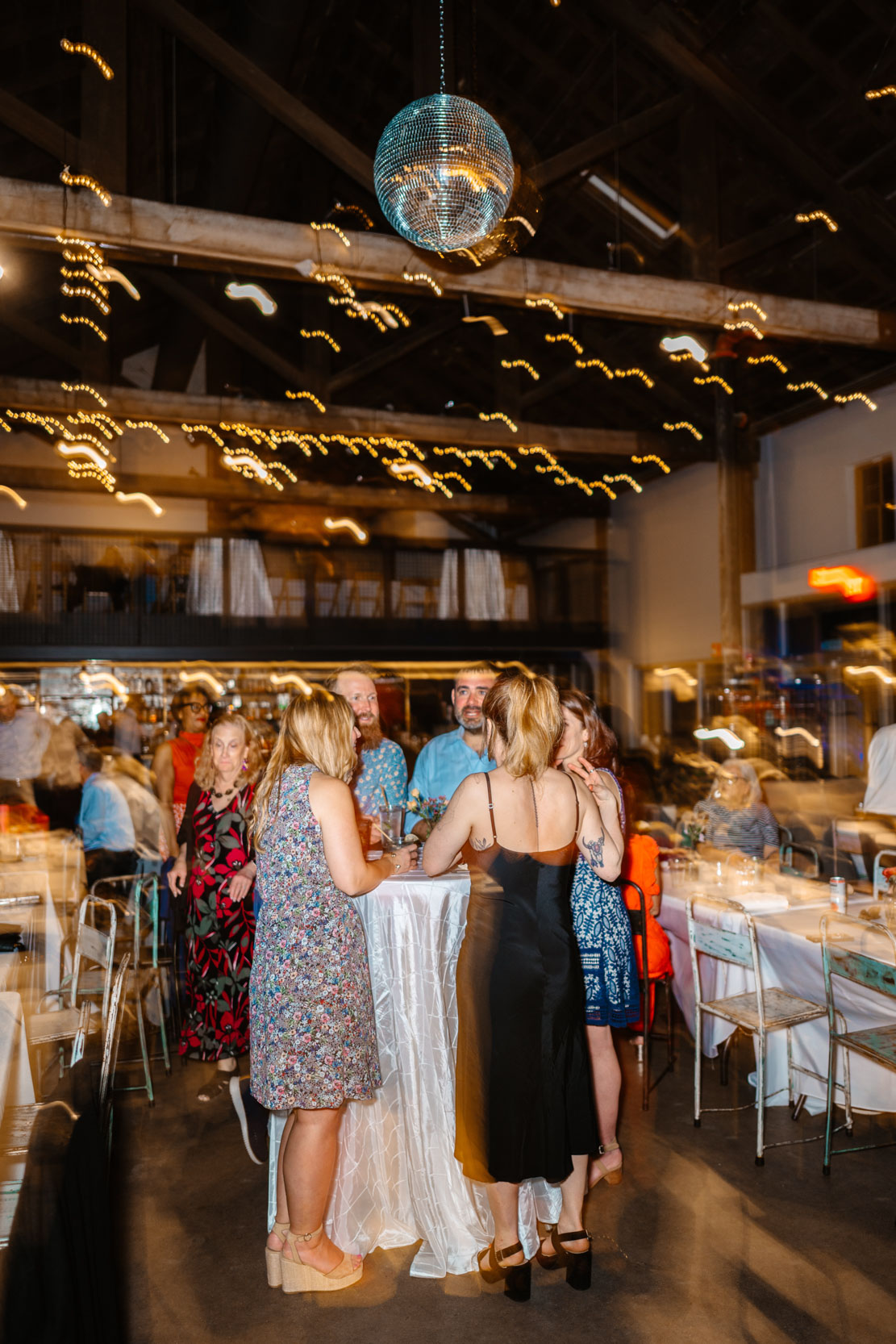 motion blur photo of lights and wedding guests partying during wedding reception at Capulet in the New Orleans Bywater