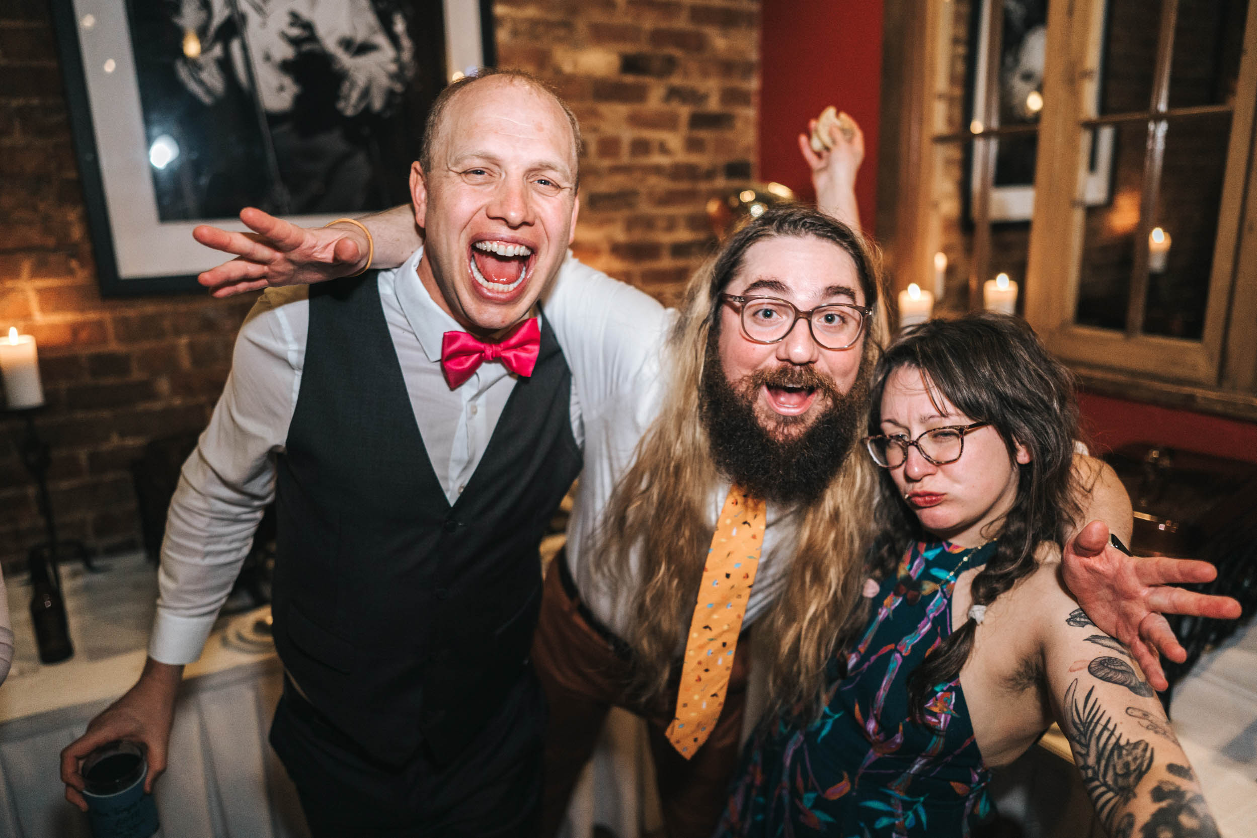 wedding guets laughing and partying during wedding reception at Rosy's Jazz Hall in New Orleans