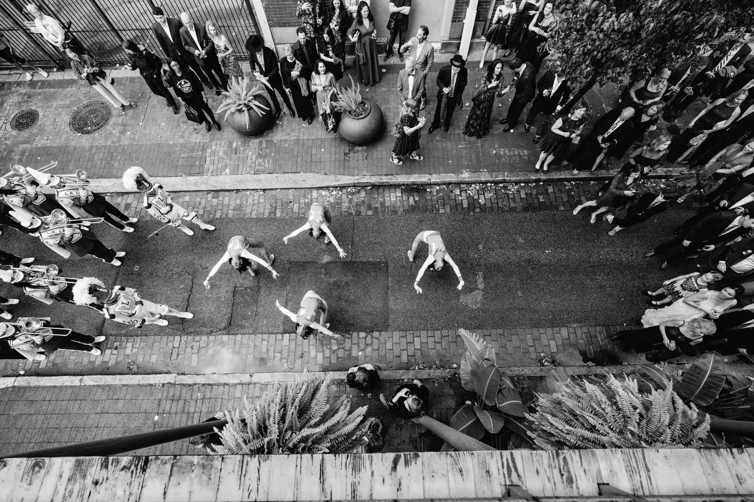 a marching band parade in the French Quarter New Orleans on wedding day