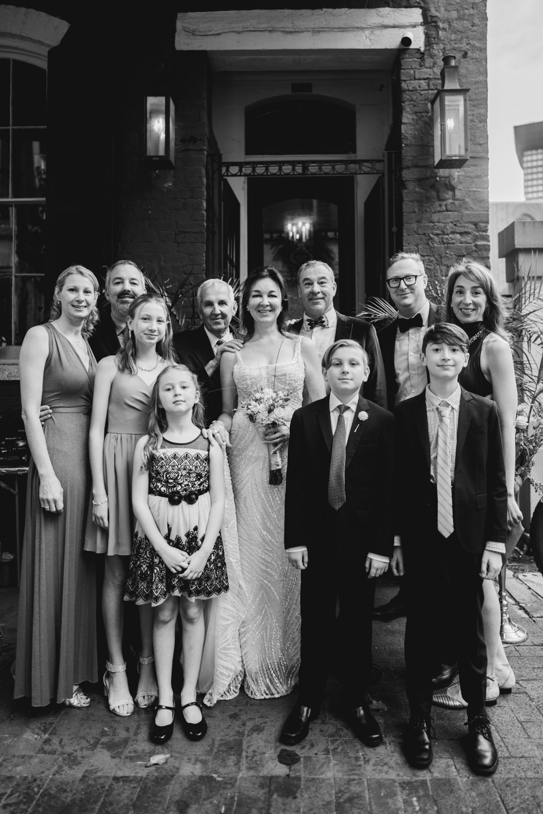 family photo on wedding day in front of the Historic Swoop Duggins House in New Orleans