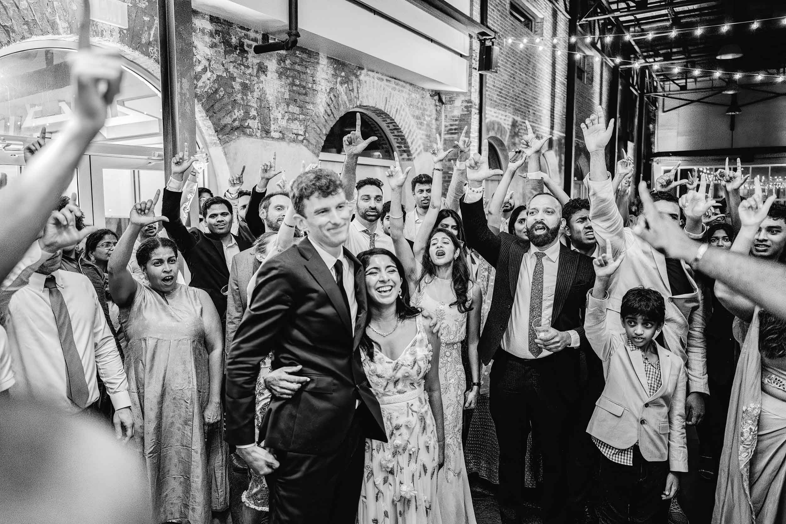 American Indian bride and groom celebrating at their wedding reception with their guests at the Solomon Theater NOCCA in New Orleans