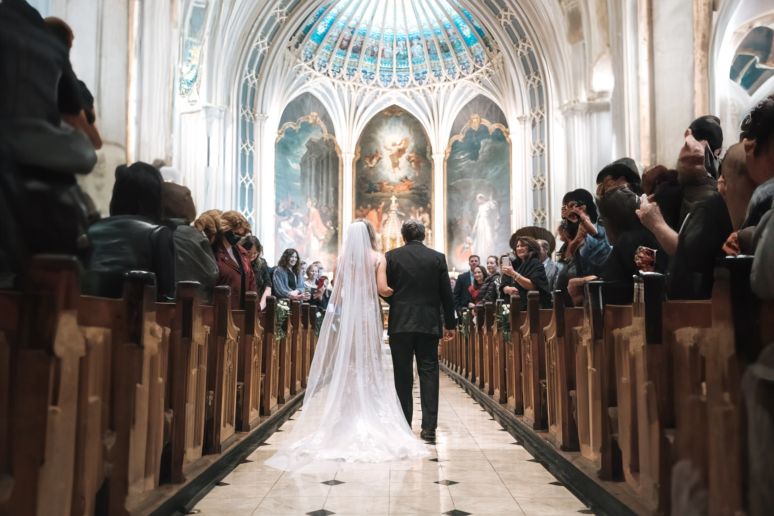 Bride and father walking up aisle of St. Patrick's Church in New Orleans