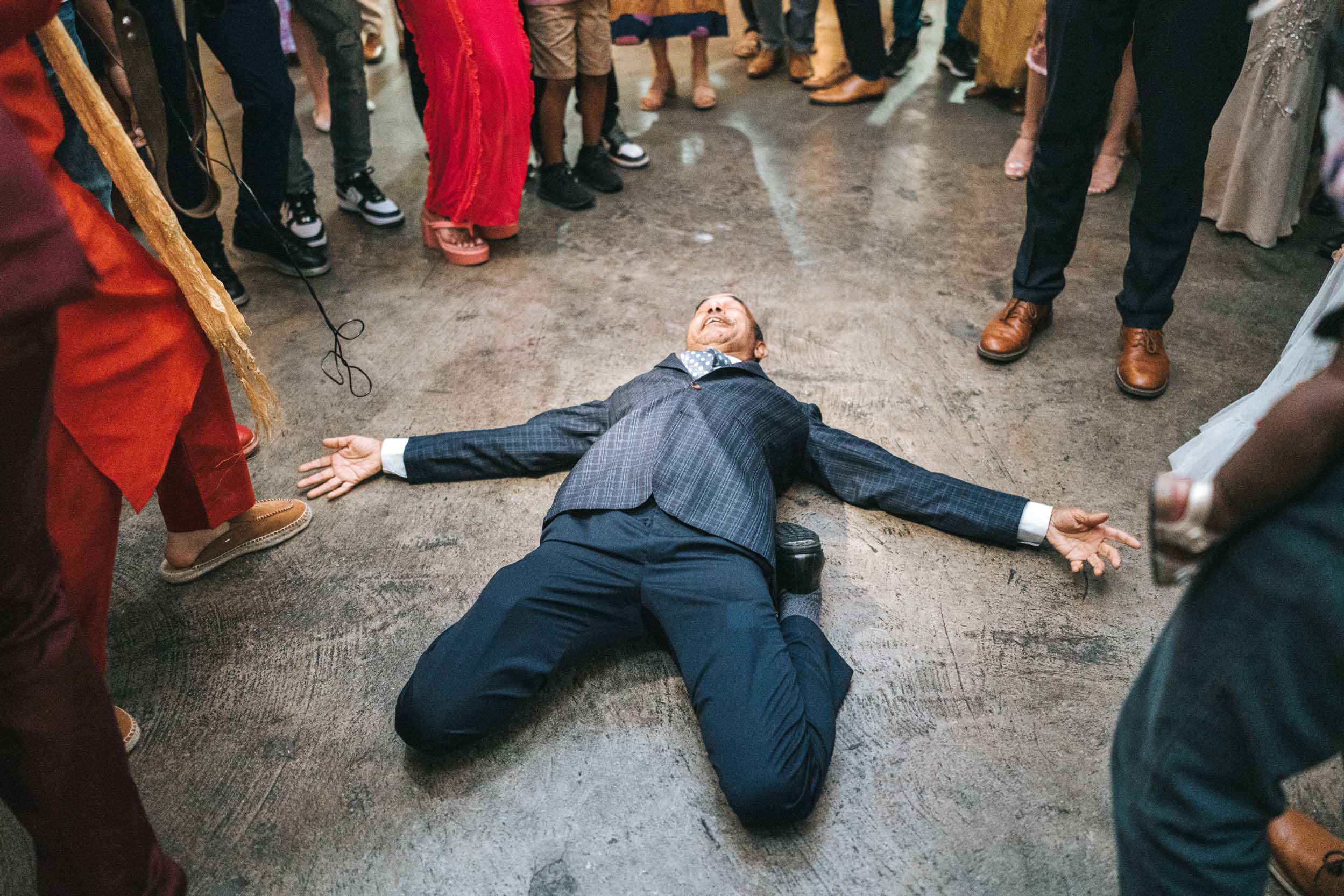 Hindu Indian wedding guest break dancing during wedding reception at the Solomon Theater NOCCA in New Orleans