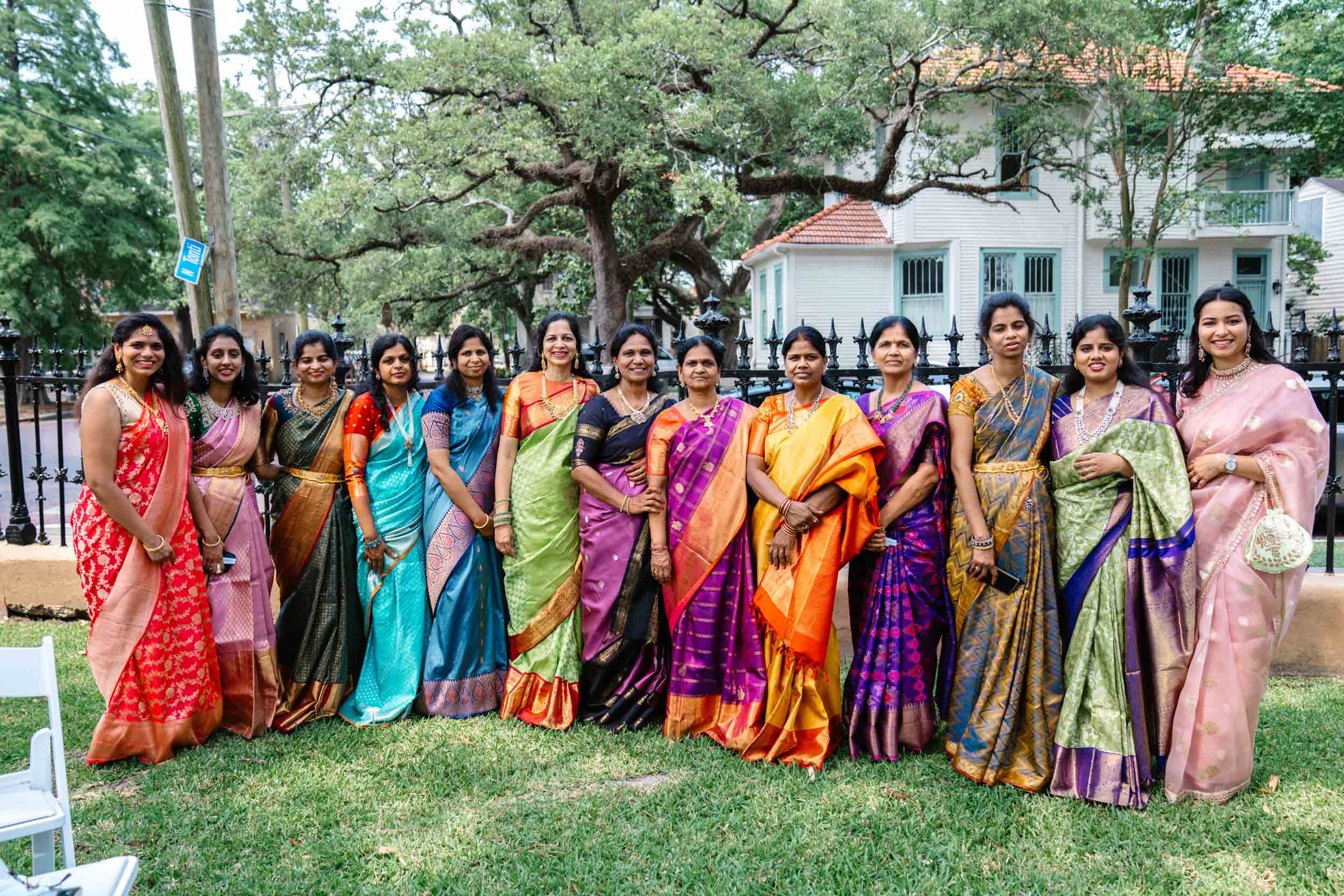 Indian women wearing lehenga and saree dresses at Hindu wedding at Derbès Mansion in New Orleans