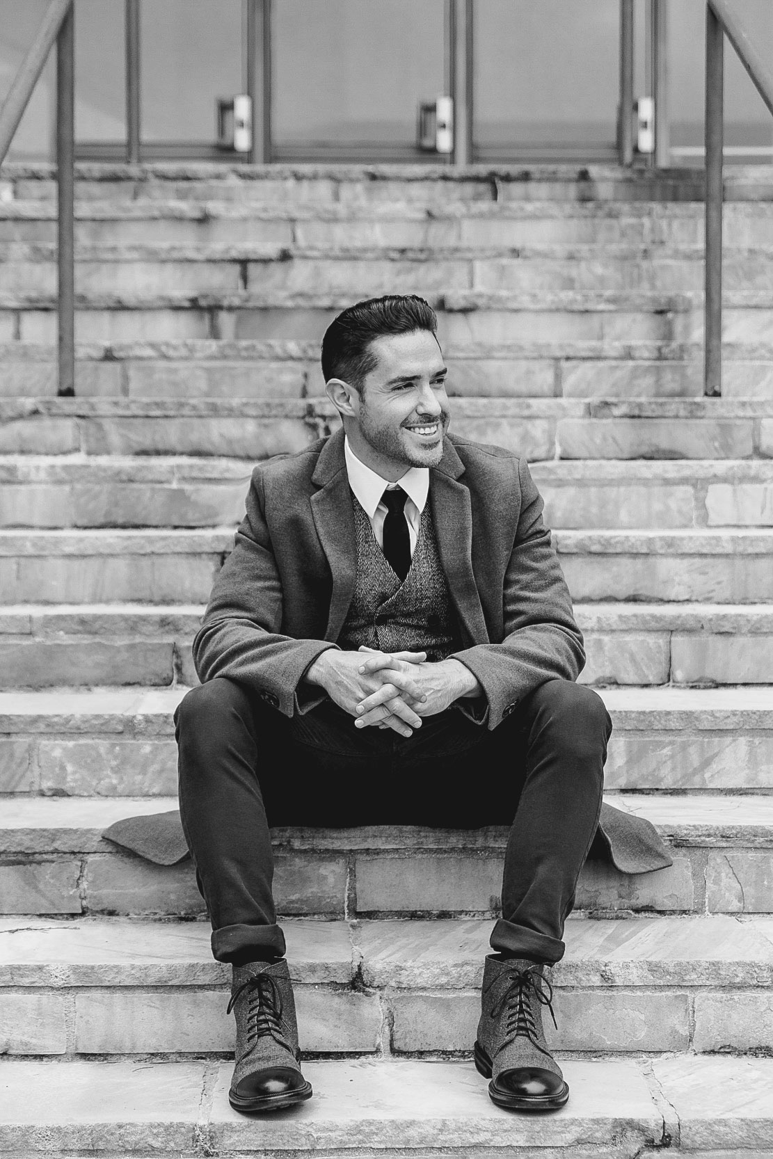 Shades of Gray Photography (Ryan H Gray) posing on stairs in Louis Armstrong Park before shooting a wedding