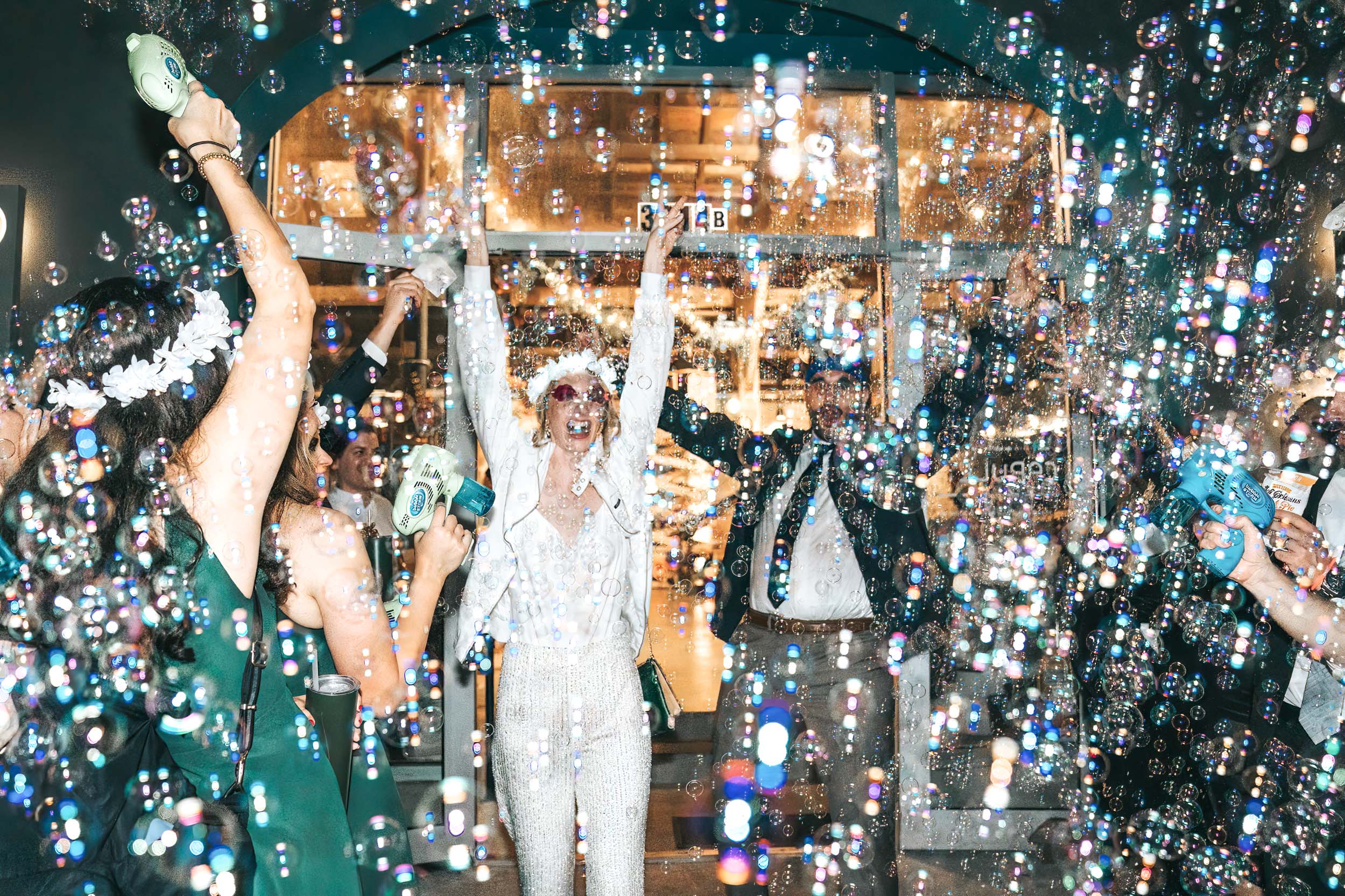 bride and groom celebrating their wedding exit with bubbles and sparklers at Capulet in New Orleans