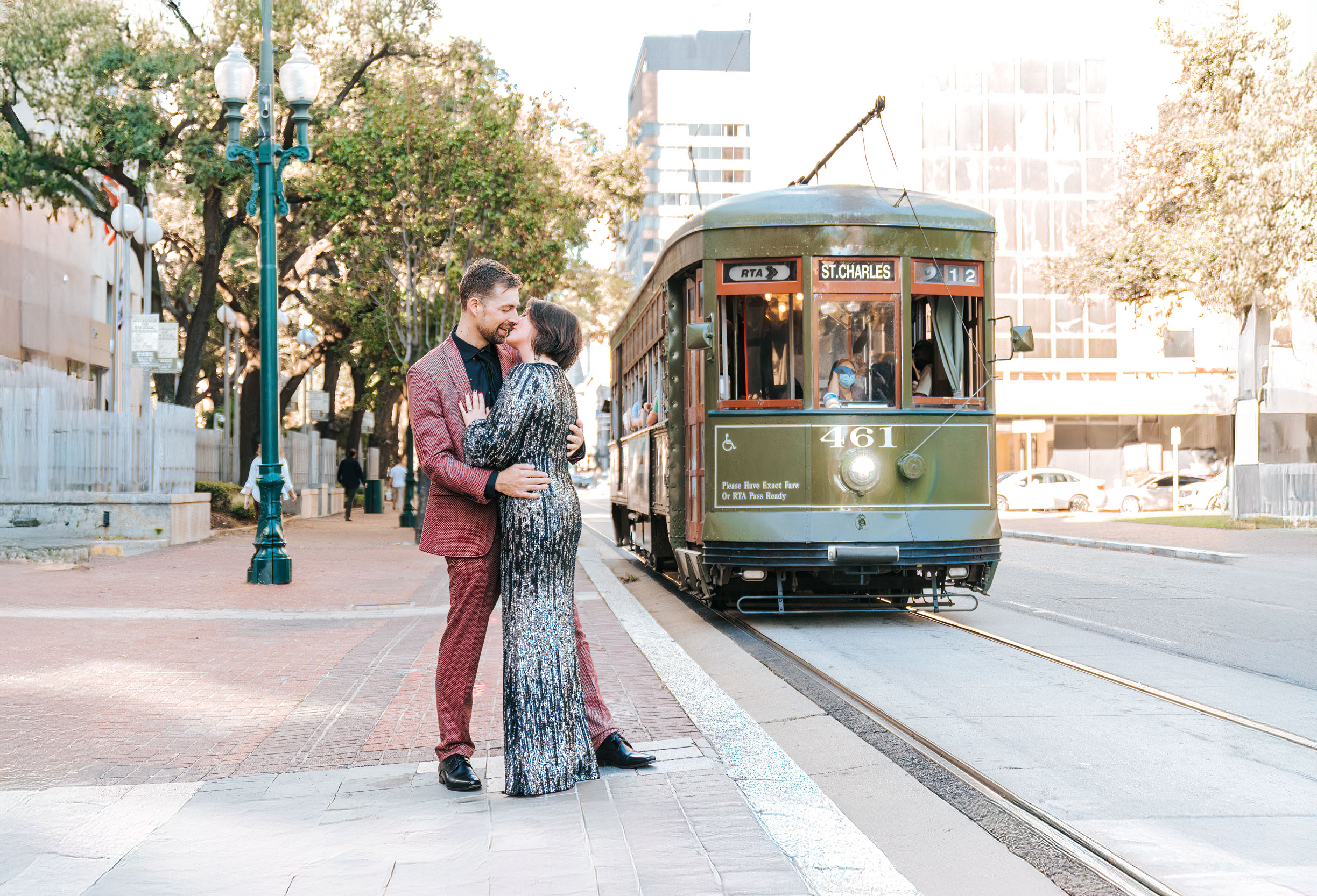 bride and groom getting eloped in front of streetcar trolley in New Orleans